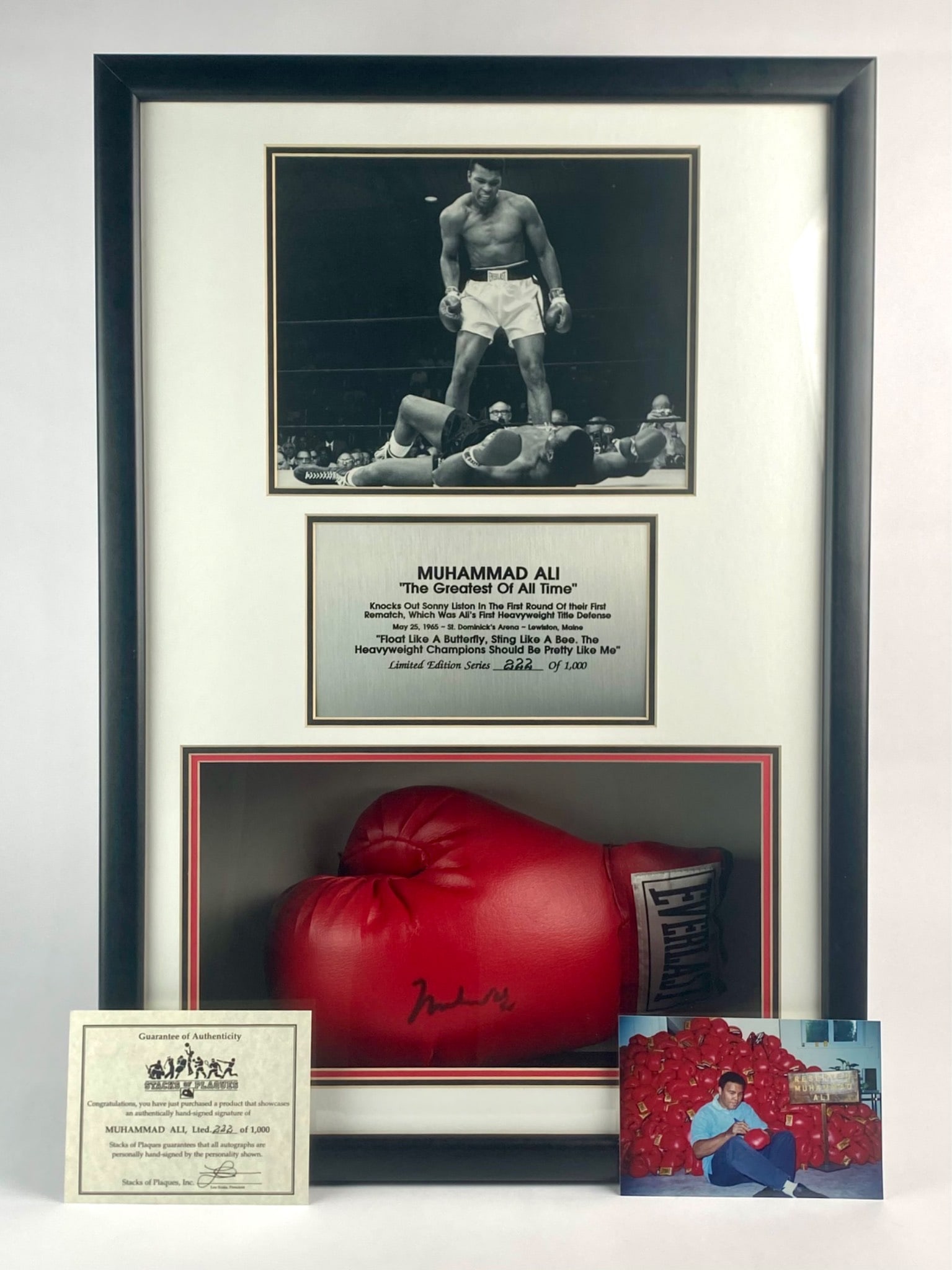 Muhammad Ali Signed Limited Edition Everlast Boxing Glove (COA): Framed Muhammad Ali collectible display featuring an authentic hand-signed red Everlast boxing glove, accompanied by a black and white photograph of Ali's victory over Sonny Liston on May 25, 1965, in