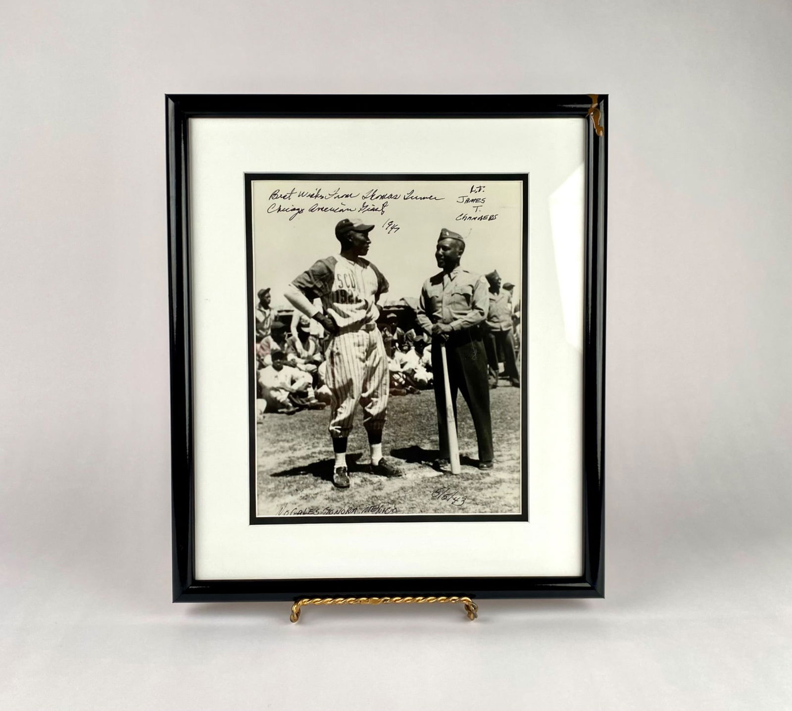 Photograph Inscribed "Thomas Turner Chicago American Giants, 1947": Framed black and white photo of Chicago American Giants Negro Leagues player Lt. James T. Chambers. The photo bears an ink inscription at the top of the reading "Best wishes from Thomas Turner, Chicag