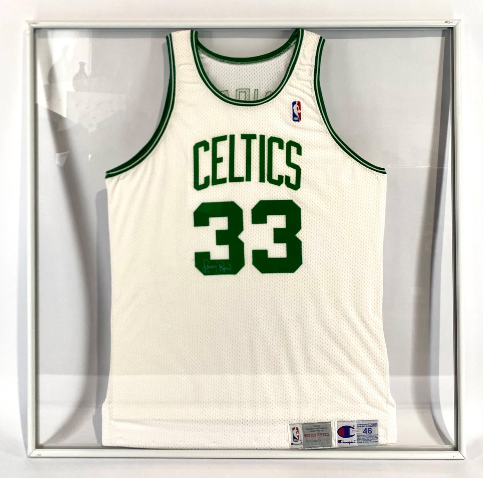 Larry Bird Boston Celtics Signed Jersey in Framed Display Case: Larry Bird's Boston Celtics #33 jersey, manufactured by Champion, size 46, and featuring Body Length +3. Professionally framed within a display case, showcasing both the front and back. The jersey inc