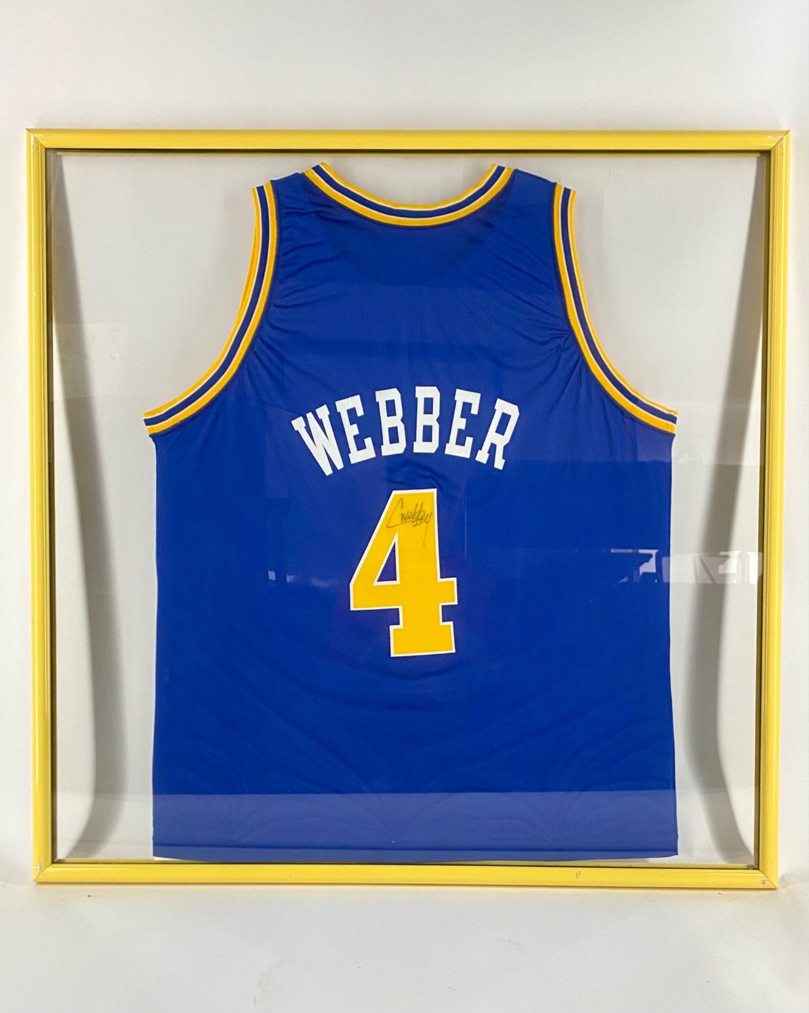 Chris Webber Signed Golden State Warriors Framed Jersey: Framed Golden State Warriors jersey, autographed by Chris Webber with his number "4" inscribed. The autographed is located on the back number in black marker. The jersey is professionally displayed in