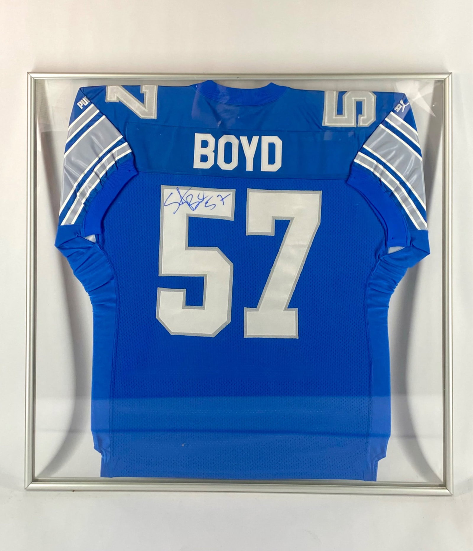 Stephen Boyd Signed Detroit Lions Game-Style Framed Jersey: Detroit Lions jersey signed by former linebacker Stephen Boyd, who played his entire career with the Lions. The jersey is a Puma NFL Pro Line game-style in Lions blue with silver and white tackle twil