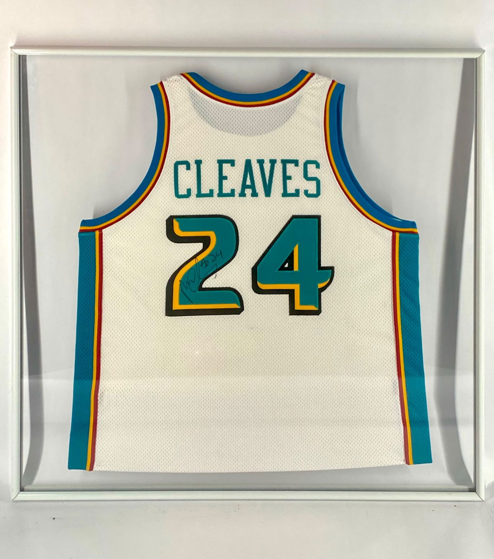 Mateen Cleaves Signed Detroit Pistons Framed Jersey: Detroit Pistons jersey signed by former guard Mateen Cleaves. The white teal-era Pistons jersey features Cleaves' name and number 24 on the back, with his autograph and "#24" inscribed on the numeral.