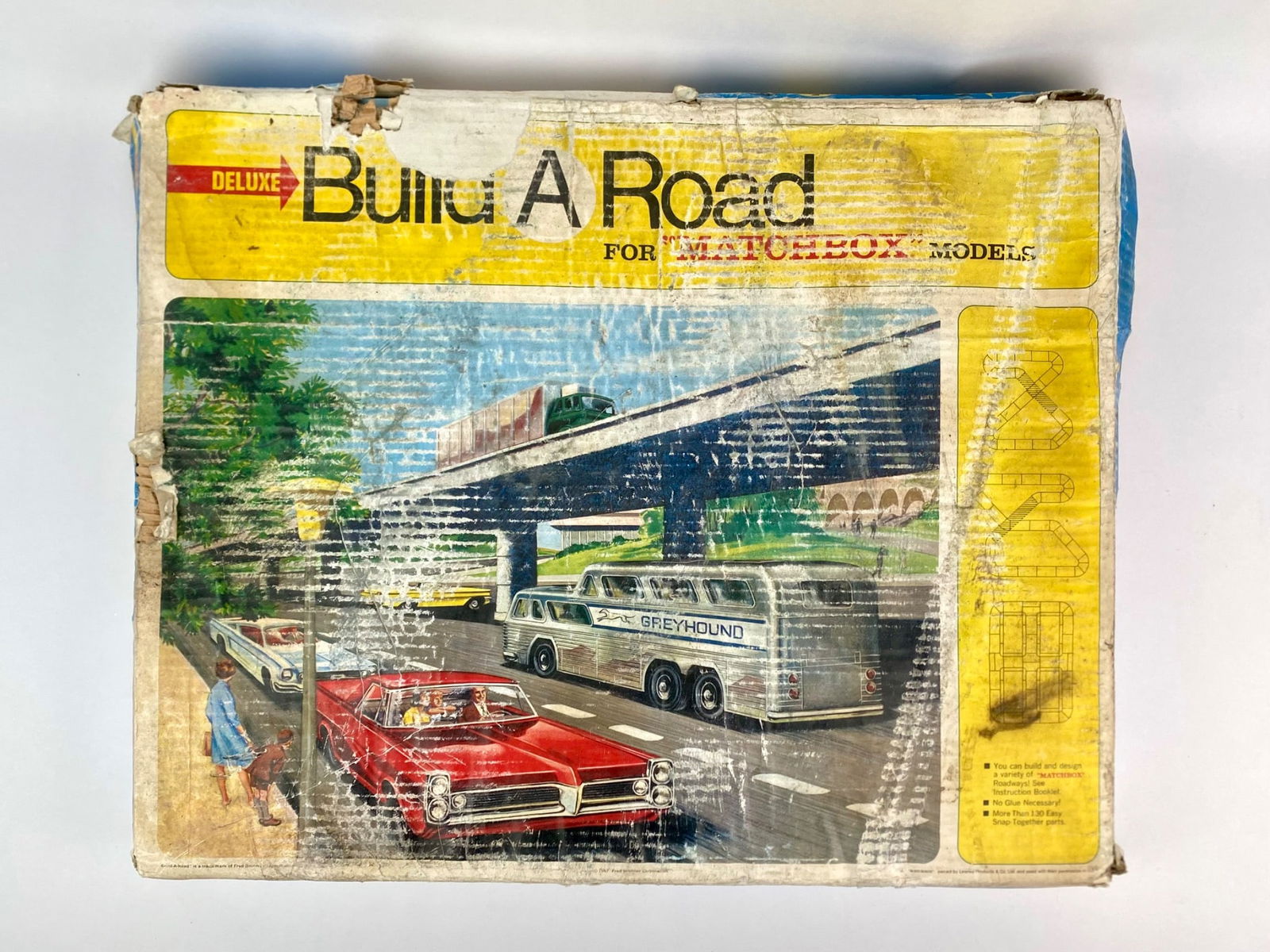 Deluxe Build A Road for Matchbox Models with Original Box: Vintage Deluxe Build-A-Road set made for Matchbox models. The set includes more than 130 snap-together roadway parts for designing and building a variety of Matchbox roadways. Components include strai