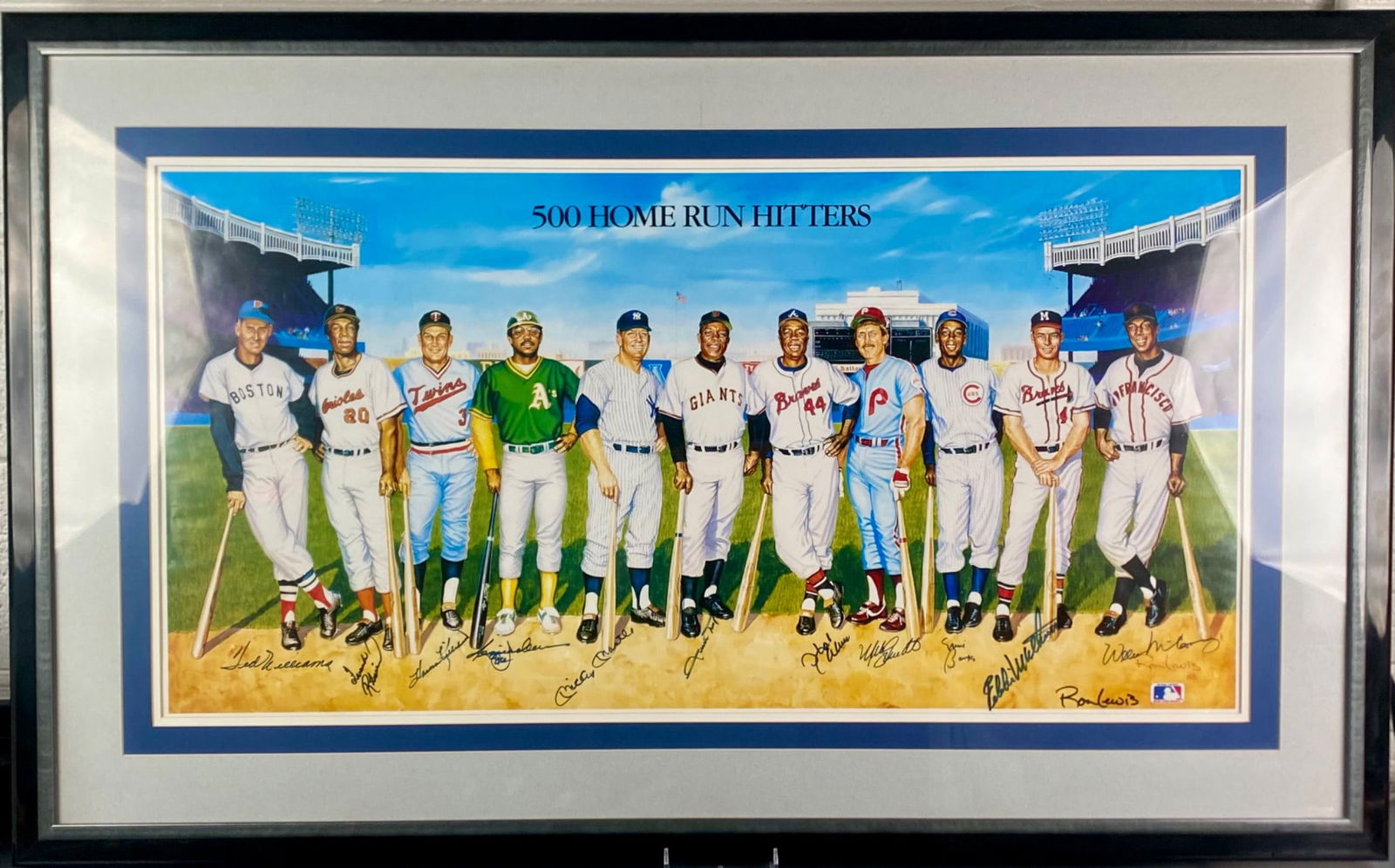 500 Home Run Hitters; Lithograph Signed by Players and Artist Ron Lewis: Framed lithograph titled 500 Home Run Hitters by artist Ron Lewis featuring a lineup of Major League Baseball legends. The piece is hand-signed along the lower border by Ted Williams, Frank Robinson,
