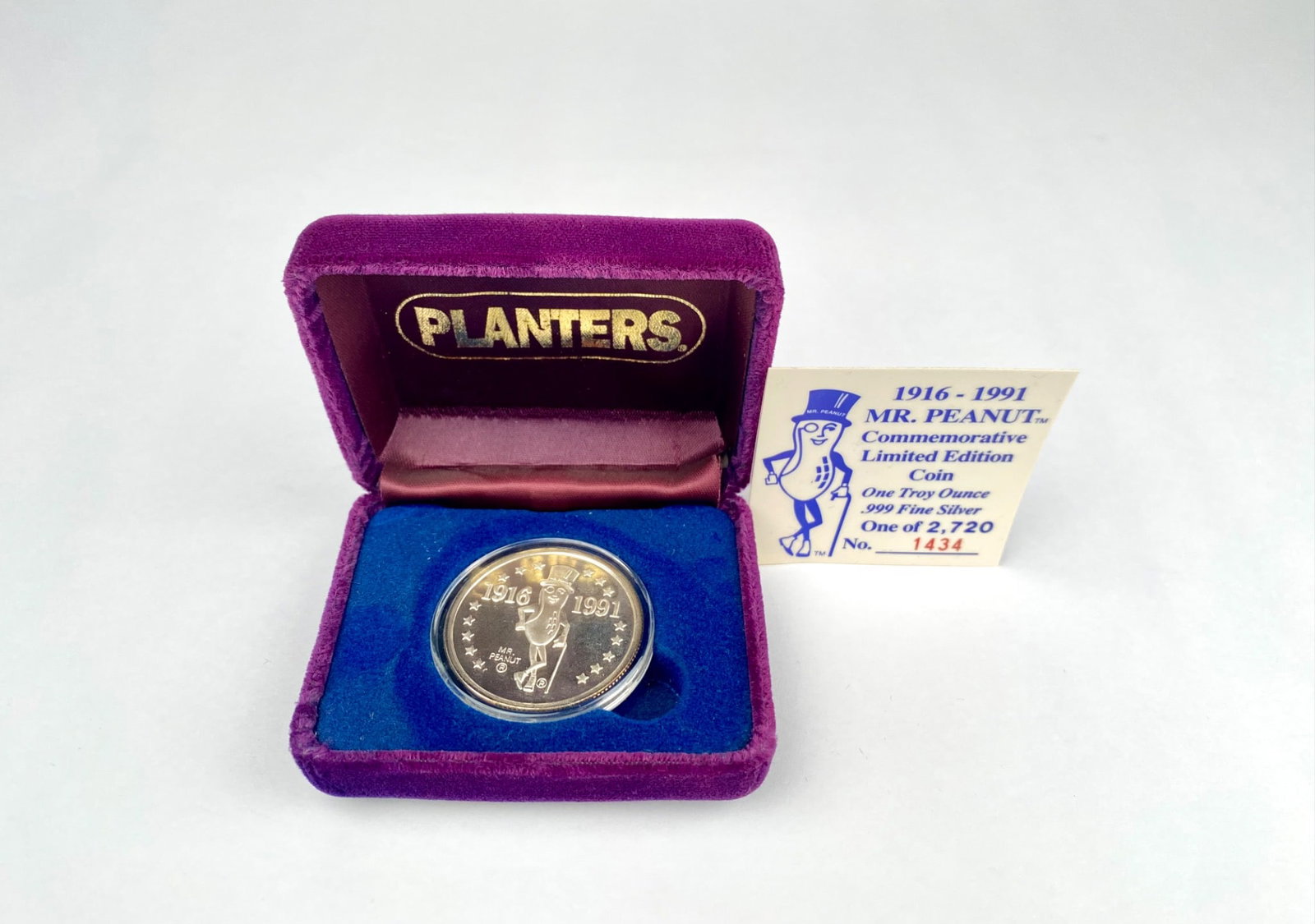 Mr. Peanut Limited Edition .999 Fine Silver Coin with Velvet Case: Commemorative Mr. Peanut limited edition coin celebrating the brand's 75th anniversary (1916-1991). One troy ounce of .999 fine silver. Includes original numbered certification card (no. 1434 out of 2