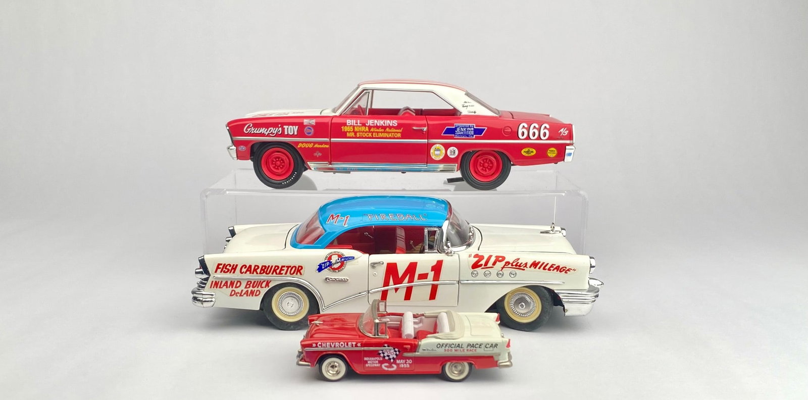 Three Die-Cast Model Cars Including Buick, Chevrolet Pace Car, and Chevy Nova: Three detailed die-cast model cars, including a 1955 Chevrolet Pace Car (Official Pace Car for the 500 Mile Race), a 1956 Buick Special M-1 with detailed engine and trunk components, and a 1968 Chevy 