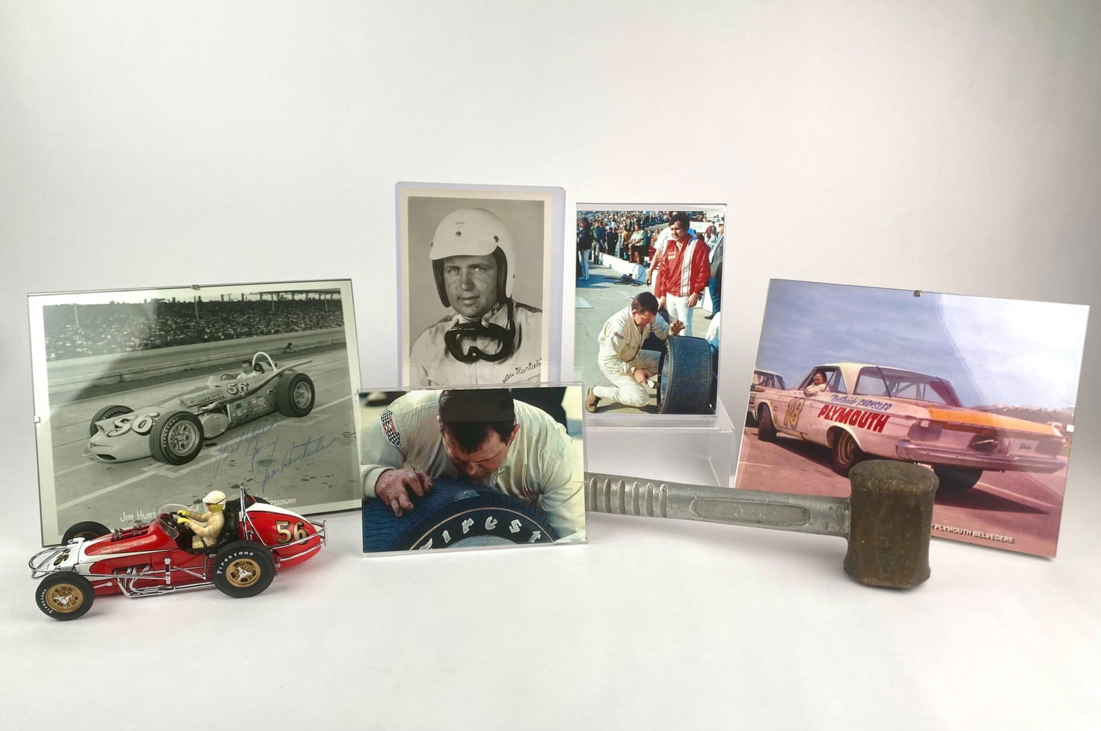 Jim Hurtubise Racing Memorabilia, Signed Photo, Model Car (COA, box) , and Indianapolis 500 Hammer: Jim Hurtubise memorabilia collection featuring multiple artifacts from the American race car driver. Includes is a black and white photograph of Hurtubise at the 1964 Indianapolis Motor Speedway, hand
