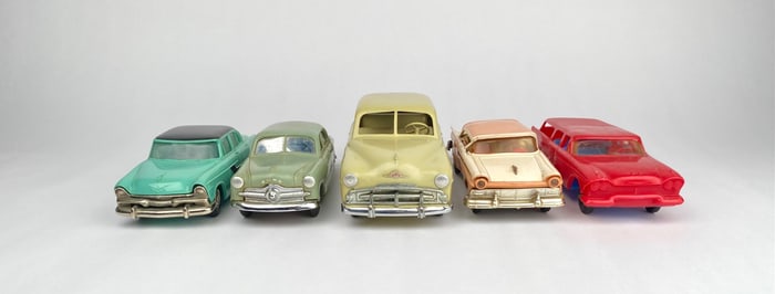 Five Vintage Plastic Toy Cars from Various Makers