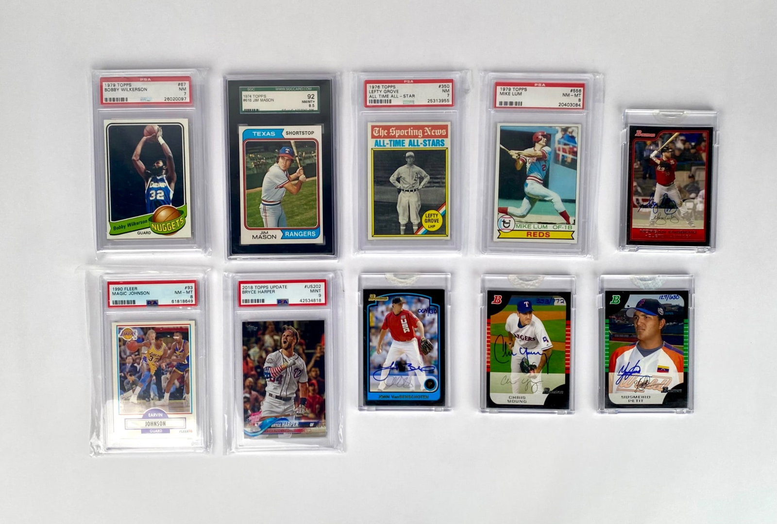 Lot of 10 Graded & Signed Sports Cards: 10 sports cards, each professionally graded and encapsulated by PSA, including baseball and basketball cards. Features autographed cards such as Morgan Ensberg, John VanBenschoten, Chris Young, and Yu