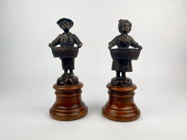 Pair of Theodore Alexander “Fruit Sellers" Boy & Girl Sculptures on Wood Base