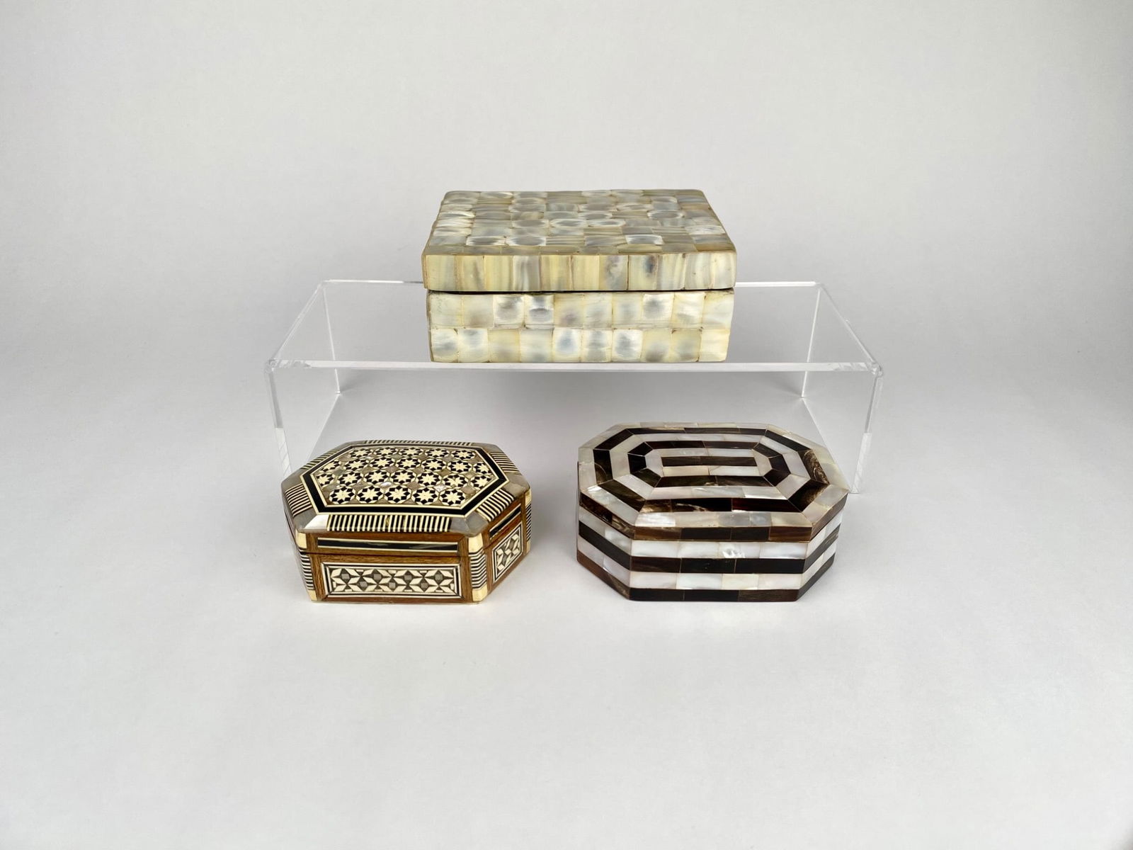 3 Decorative Boxes (Including Mother of Pearl and Bone Inlay): 3 decorative boxes. The first box, constructed in Egypt, features intricate inlay work with geometric and floral patterns, lined with red fabric. Made of wood, mother of pearl, and bone. The second bo