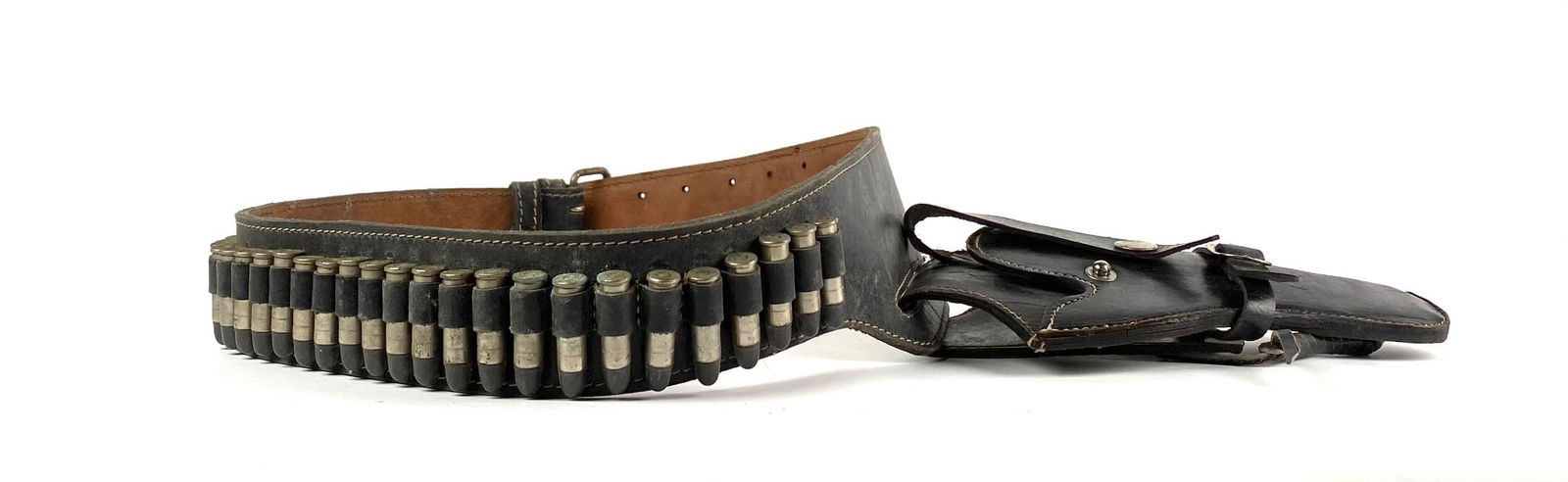 Leather Ammunition Belt with Holster: Leather ammunition belt featuring cartridge loops filled with ammo, complete with an attached holster. Designed for wear, it includes a sturdy buckle and reinforced stitching. The belt and holster sho