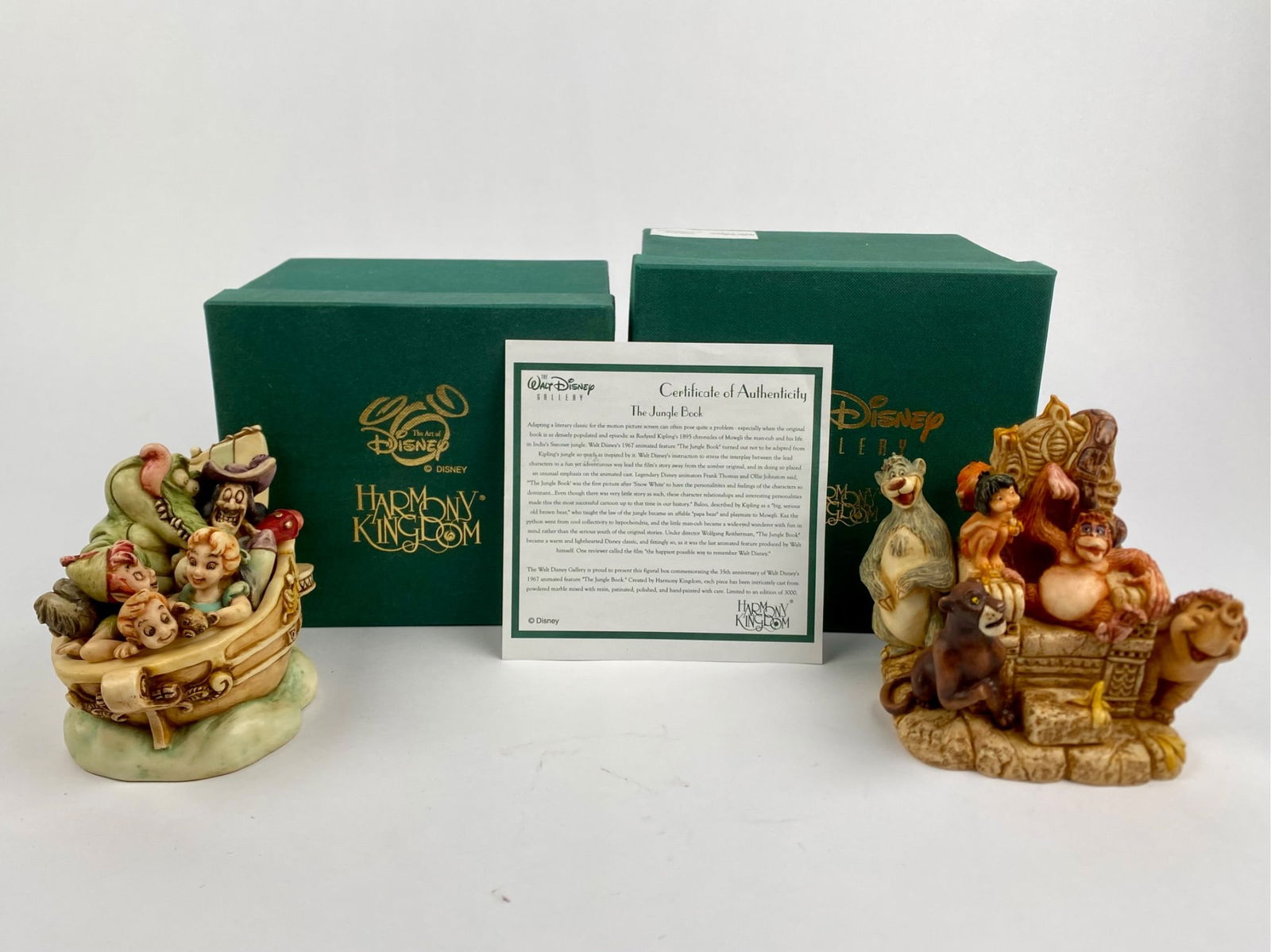 Disney Harmony Kingdom Jungle Book, Peter Pan (Original Box COA): Set of Walt Disney Classics figurines featuring scenes from The Jungle Book and Peter Pan. The Jungle Book figurine includes Mowgli, Baloo, King Louie, Shere Khan, Bagheera, Colonel Hathi, and Kaa. Th