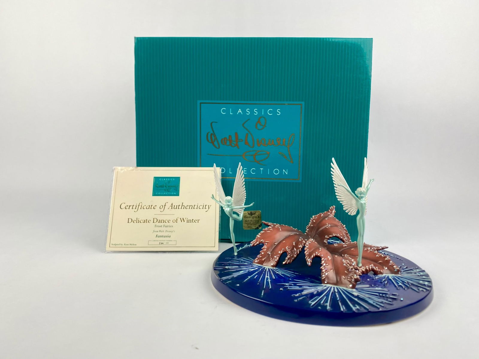 WDCC Fantasia 'Delicate Dance of Winter' Figurine (COA Original Box): Walt Disney Classics Collection figurine titled 'Delicate Dance of Winter,' featuring the Frost Fairies from Walt Disney's Fantasia. Sculpted by Kent Melton, the piece is numbered on the underside 239