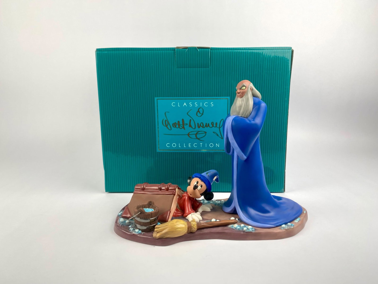 Disney Classics Collection Fantasia 2000 'Oops...' Figurine (Original Box): Walt Disney Classics Collection figurine titled 'Oops... Mickey & Yen Sid,' from Disney's Fantasia 2000. The underside is stamped with the WDCC hallmark and Fantasia 2000 production mark. Set comes wi