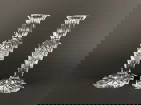 Pair of American Brilliant Hand-Cut Crystal Candlesticks: Pair of American Brilliant Period hand-cut crystal candlesticks, each featuring a faceted base, flared rim, and deeply cut geometric motifs including hobstars, cross-hatching, and fan patterns. Pair i