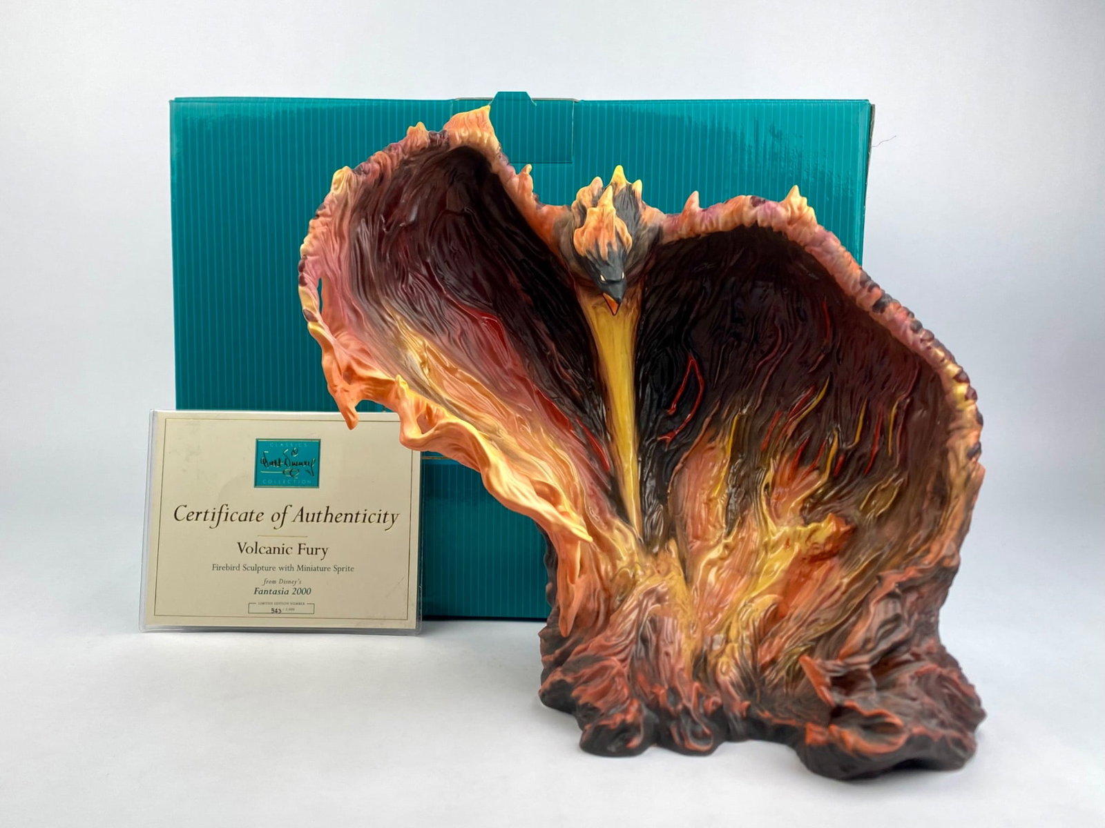 Disney Classics Collection 'Volcanic Fury' Fantasia 2000 Figurine (COA Original Box): Limited edition Walt Disney Classics Collection figurine titled "Volcanic Fury," depicting the character from Disney's Fantasia 2000. The underside bears the WDCC hallmark and edition details, 543/200