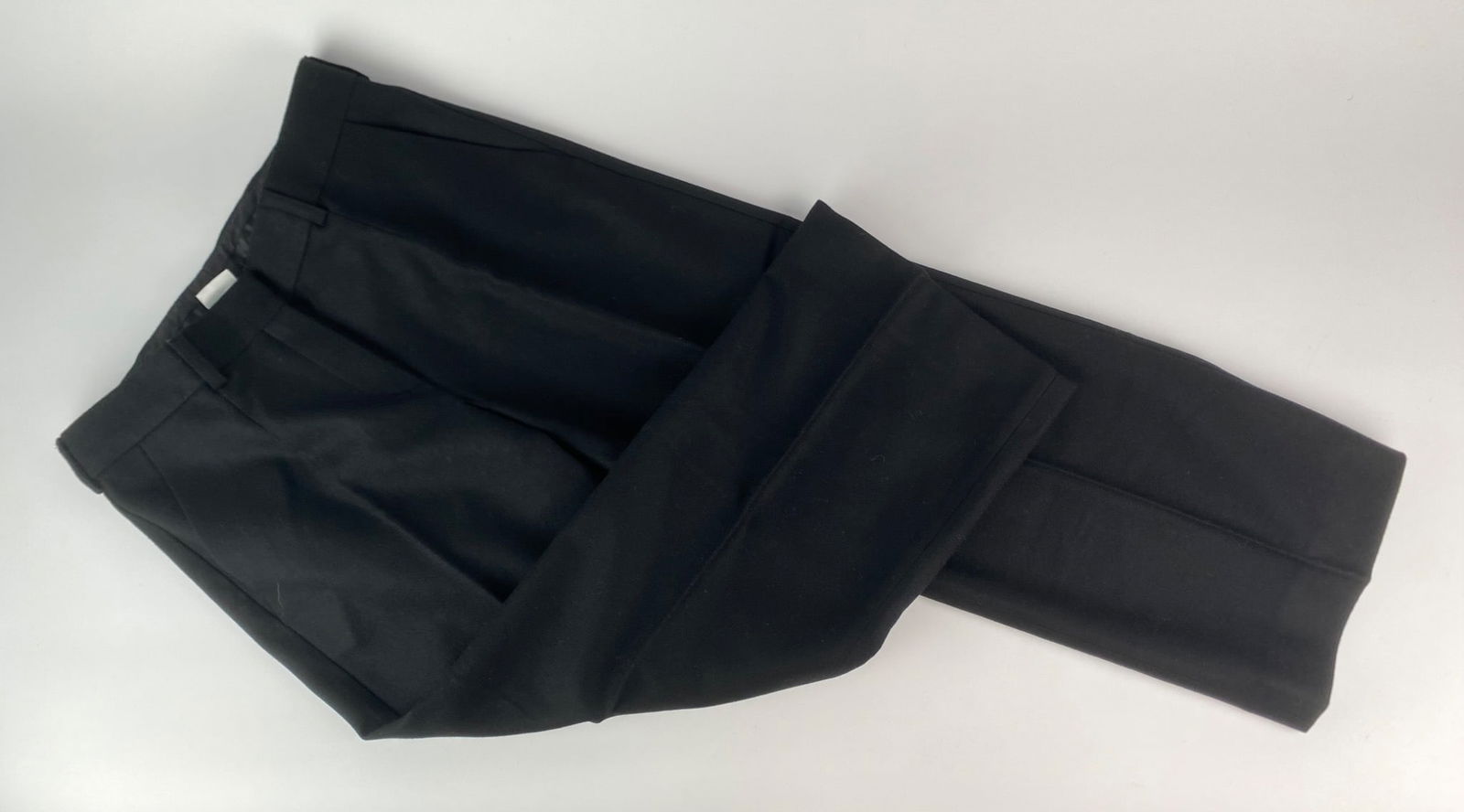 Sportmax Black Wool-Cashmere Trousers, Size 38: Pair of black trousers by Sportmax, made in Italy. The pants are constructed from a blend of wool and cashmere, with a smooth black pocket lining and front zip and clasp closure. Design details includ