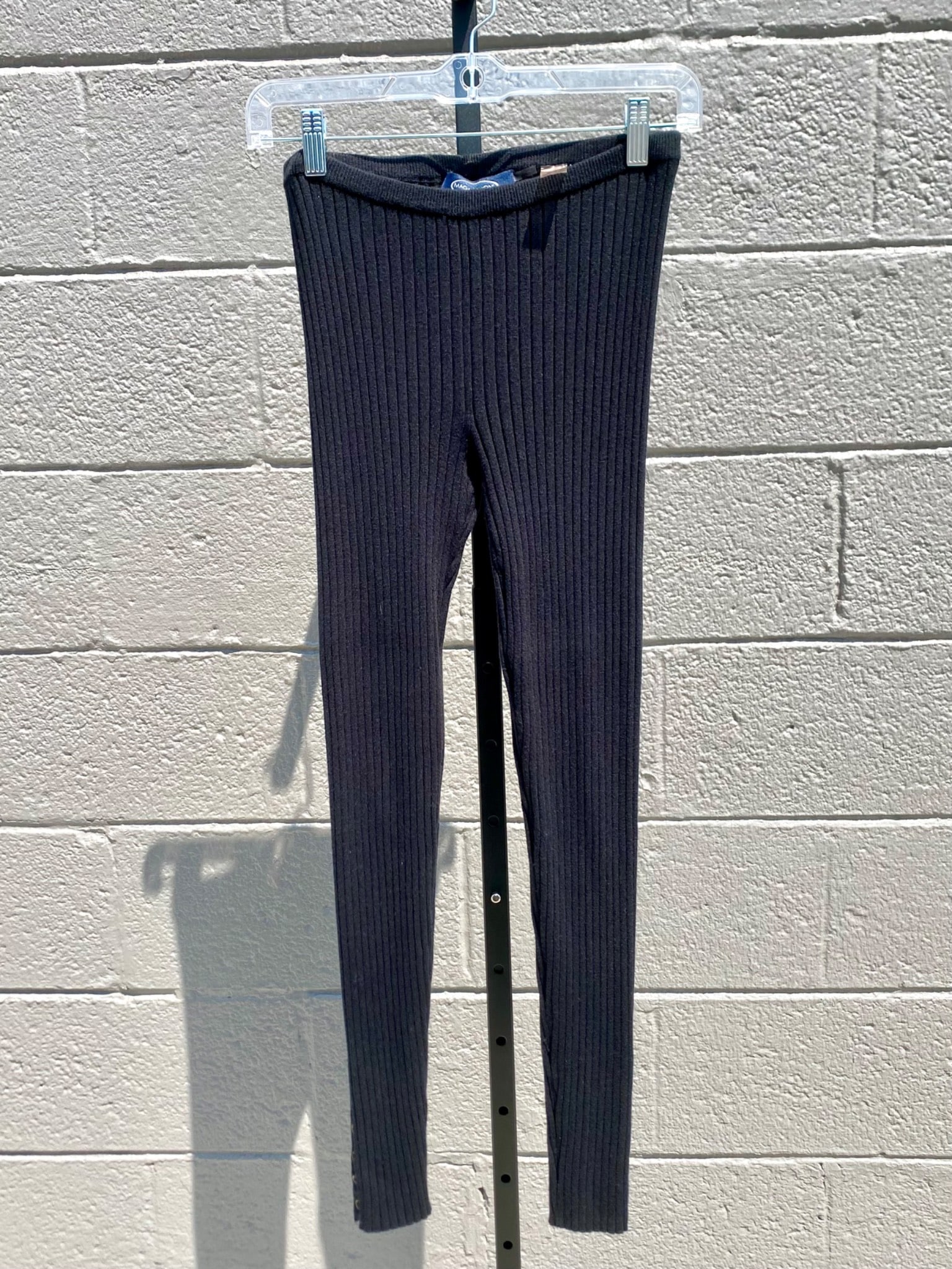 Maggaschoni Black Ribbed Knit Leggings, Size XS: Pair of black ribbed knit leggings by Magaschoni New York. Made from a blend of silk, nylon, cashmere and spandex, these leggings offer a soft and stretchy fit. The slim-cut silhouette features a high