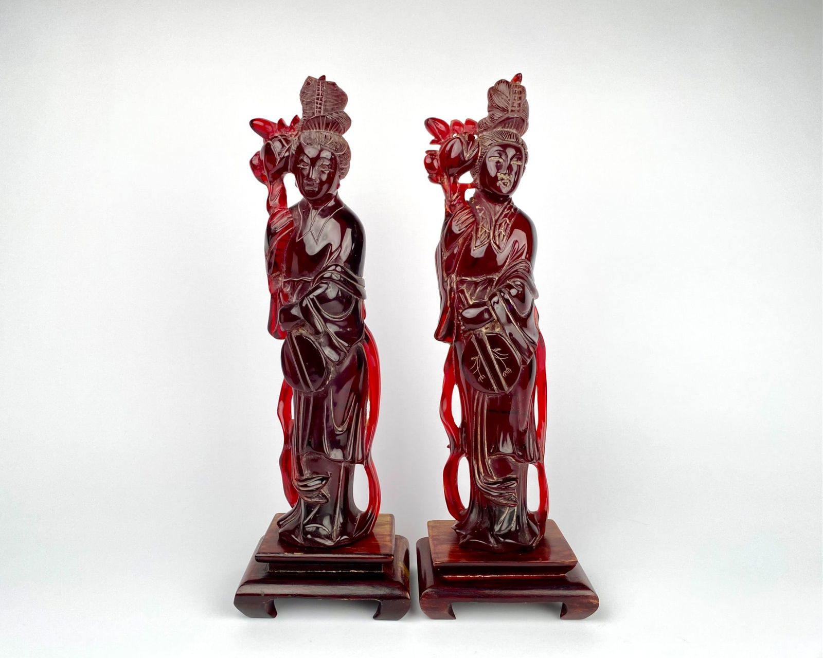 Pair of Carved Red Resin Asian Statues on Wooden Stands (1 of 11)