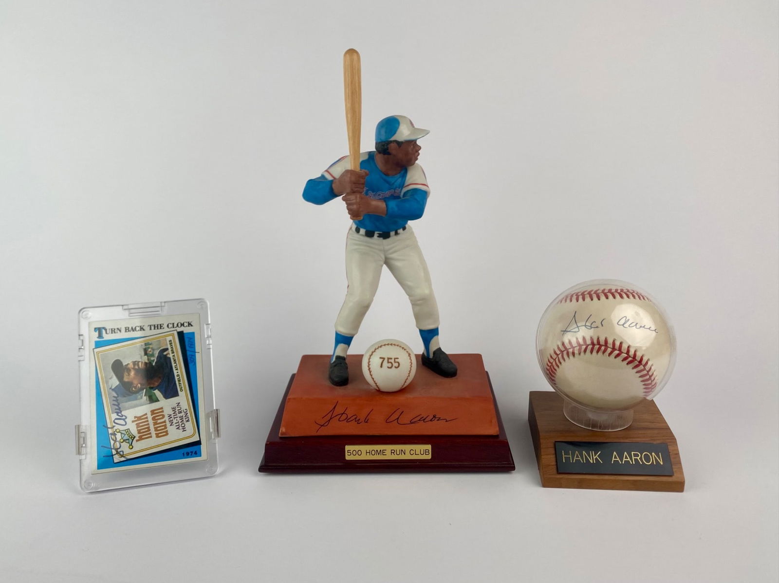 Hank Aaron Figurine, Signed Baseball, and Autographed Card Collection (1 of 12)