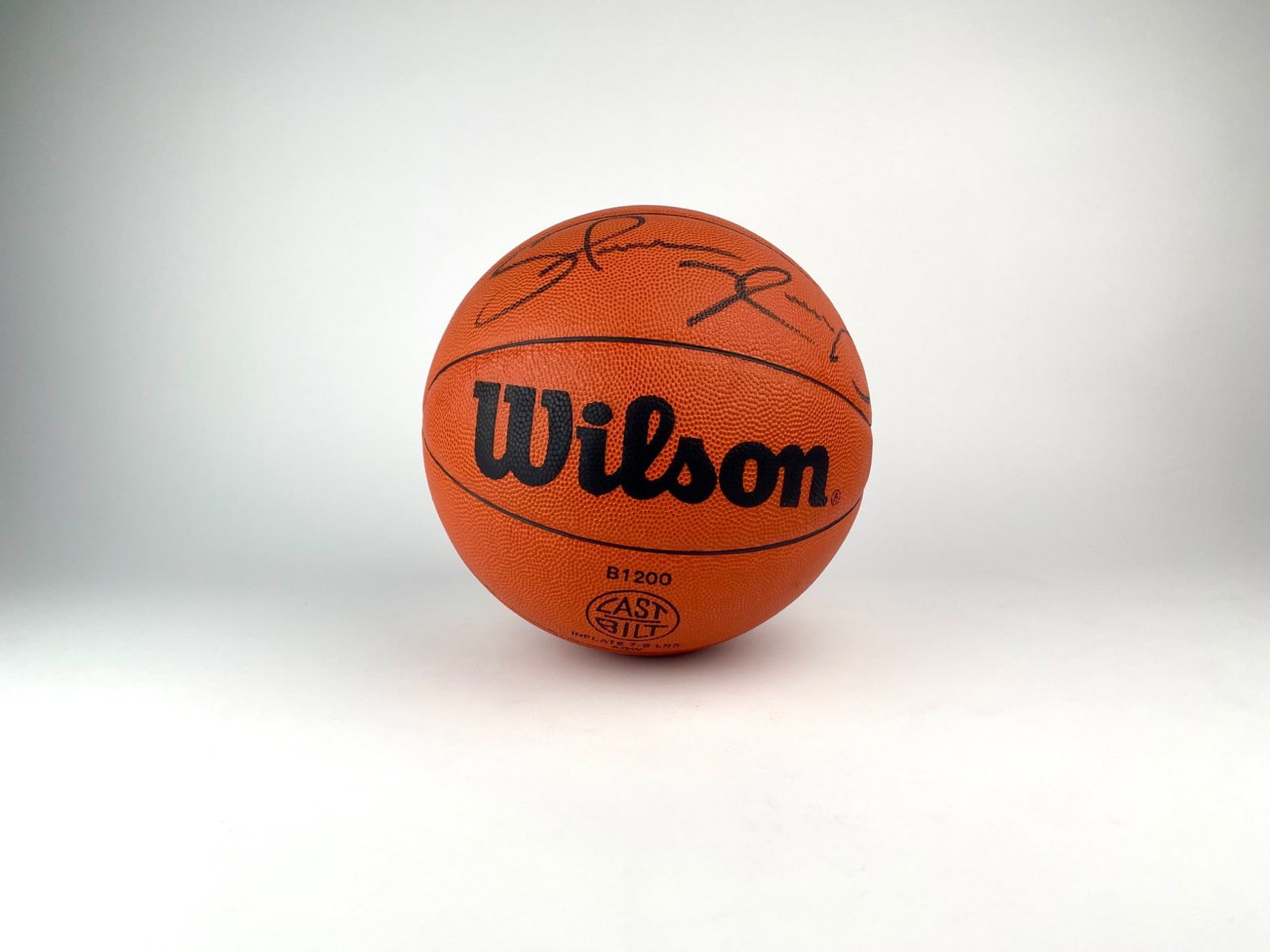 Wilson Official Basketball Signed by Spencer Dinwiddie: Wilson B1200 official size 7 basketball featuring a bold black marker signature attributed to NBA player Spencer Dinwiddie. Includes a tamper-evident sticker marked AUE41180. Basketball is in good con
