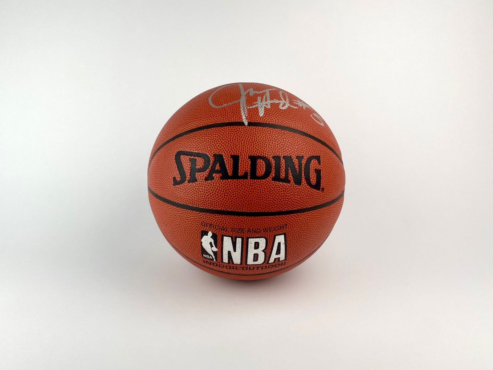 Juwan Howard Signed Spalding NBA Basketball: Official-size Spalding NBA Basketball signed in silver marker by former NBA All-Star and collegiate champion Juwan Howard. The signature includes his jersey number #5, which he wore during his NBA car