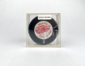 Doug Brown Autographed Detroit Red Wings Hockey Puck in Case