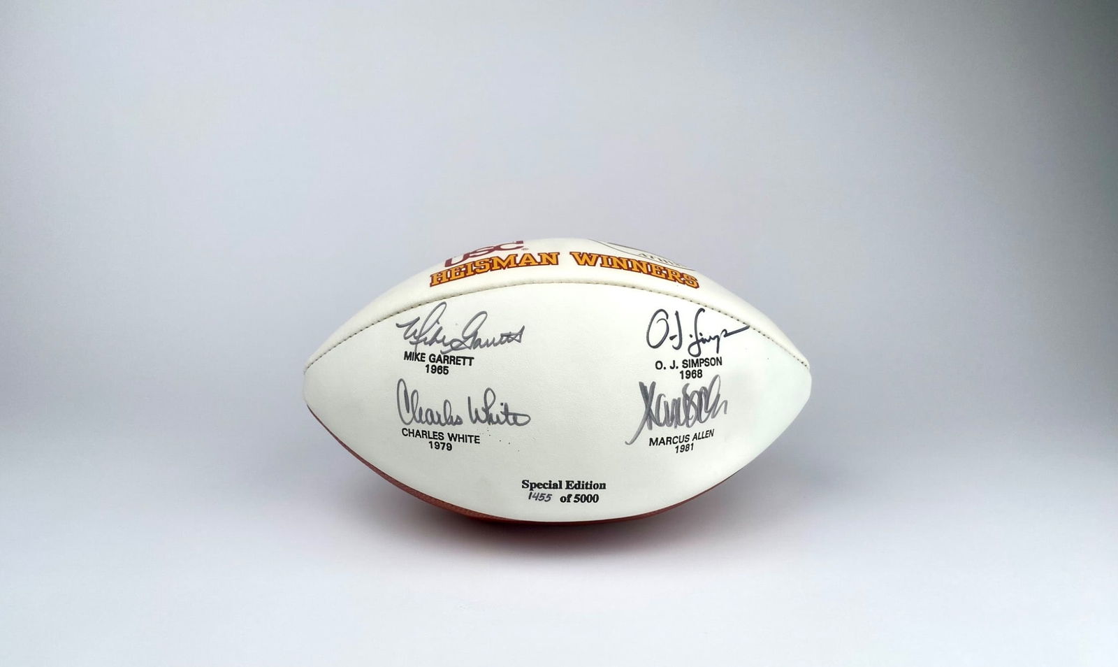Baden USC Heisman Winners Special Edition Autographed Football: Baden-made USC Heisman Winners commemorative football, featuring printed signatures of Mike Garrett (1965), O.J. Simpson (1968), Charles White (1979), and Marcus Allen (1981). Special Edition #1455 of