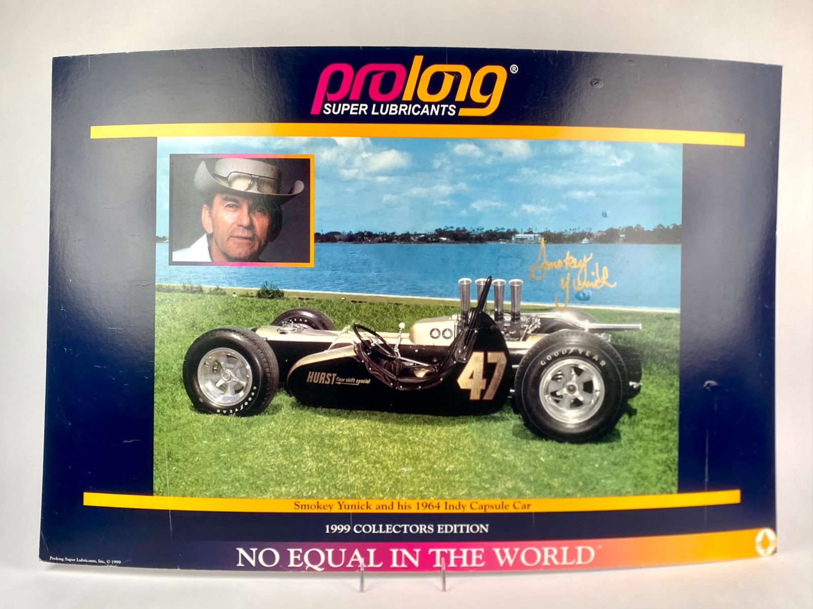 Smokey Yunick Signed 1999 Prolong Lubricants Collectors Poster: Large format 1999 “Collectors Edition” advertising poster issued by Prolong Super Lubricants, featuring Smokey Yunick’s innovative 1964 Hurst “Indy Capsule Car” #47. The poster inclu