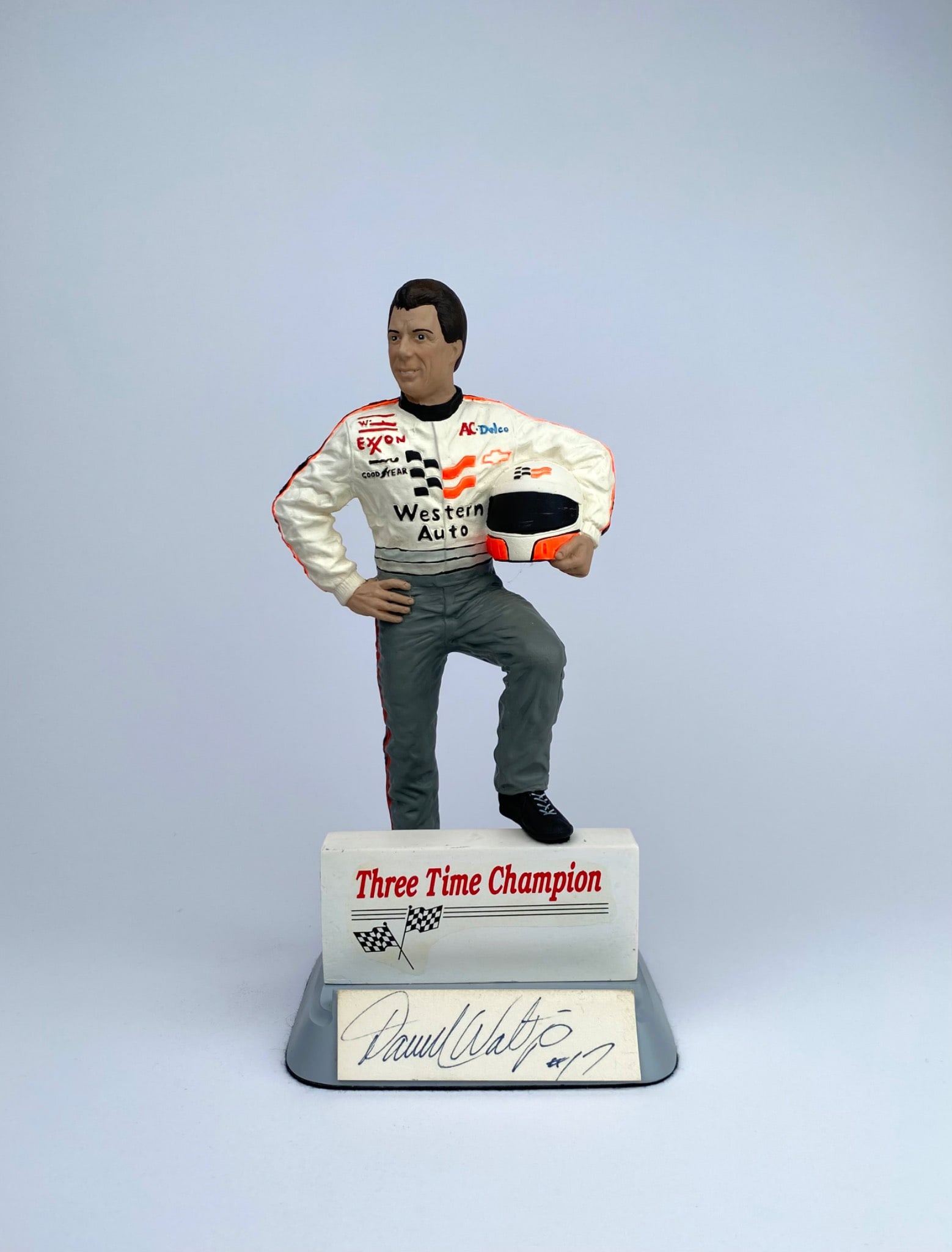Limited Edition Salvino Inc. Darrell Waltrip Figurine with Autograph: Limited edition figurine by Salvino Inc., featuring Darrell Waltrip as a three-time NASCAR Champion. The resin figure shows Waltrip in a racing suit with sponsor logos, holding a helmet, and standing