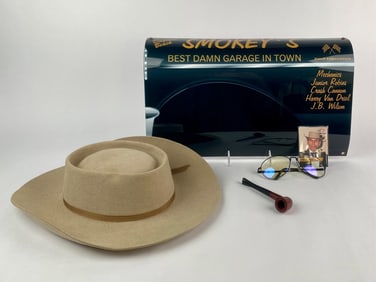 Smokey Yunick Memorabilia Collection with Hat, Pipe, Glasses, and Garage Sign