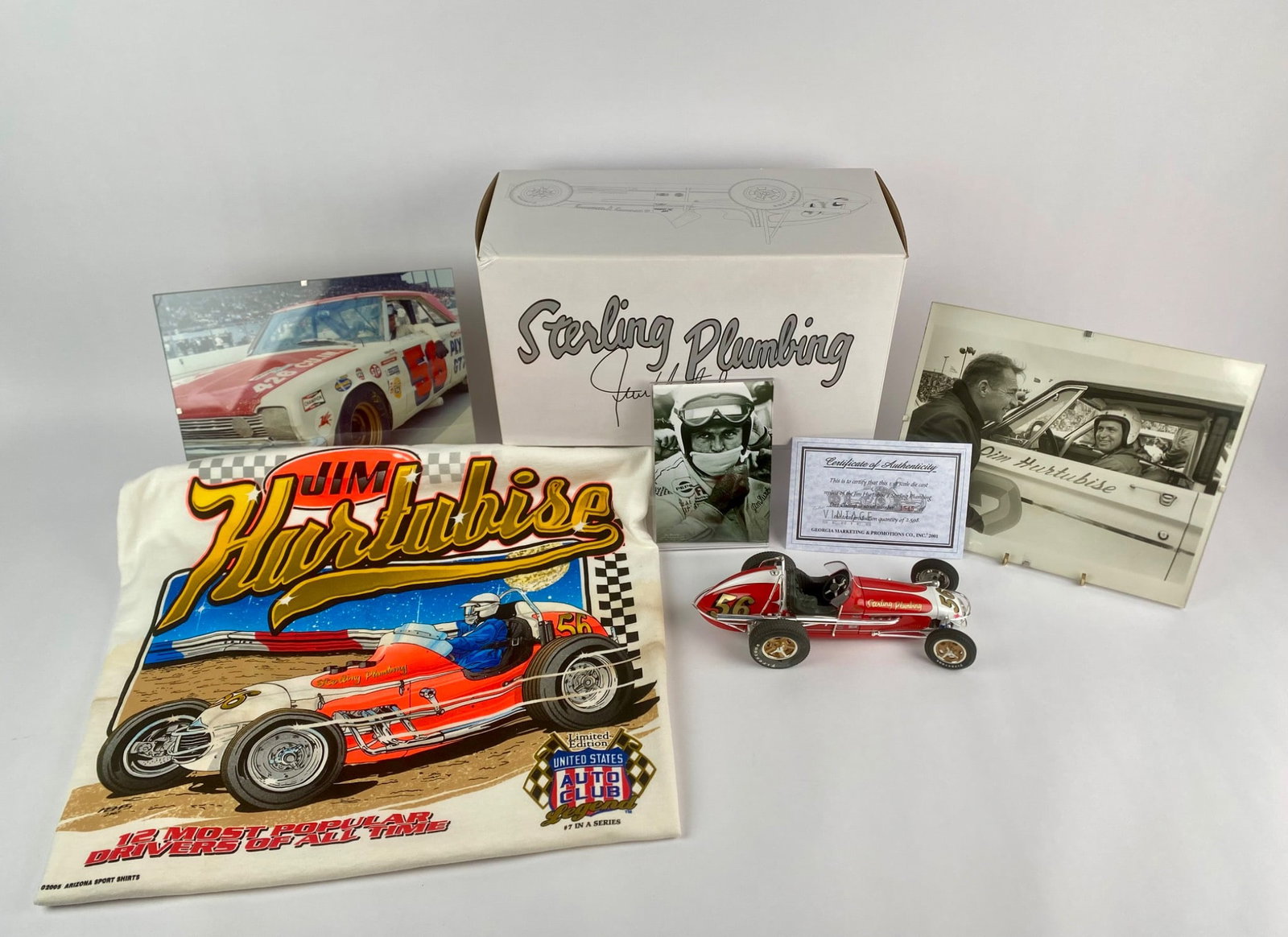Jim Hurtubise “Sterling Plumbing?? Racing Memorabilia Collection with GMP Die-Cast (COA): The lot includes a 1:18 scale GMP die-cast replica of the Sterling Plumbing #56 Dirt Champ car, presented with its original boxes and Certificate of Authenticity. Additional items include a 2005 Arizo
