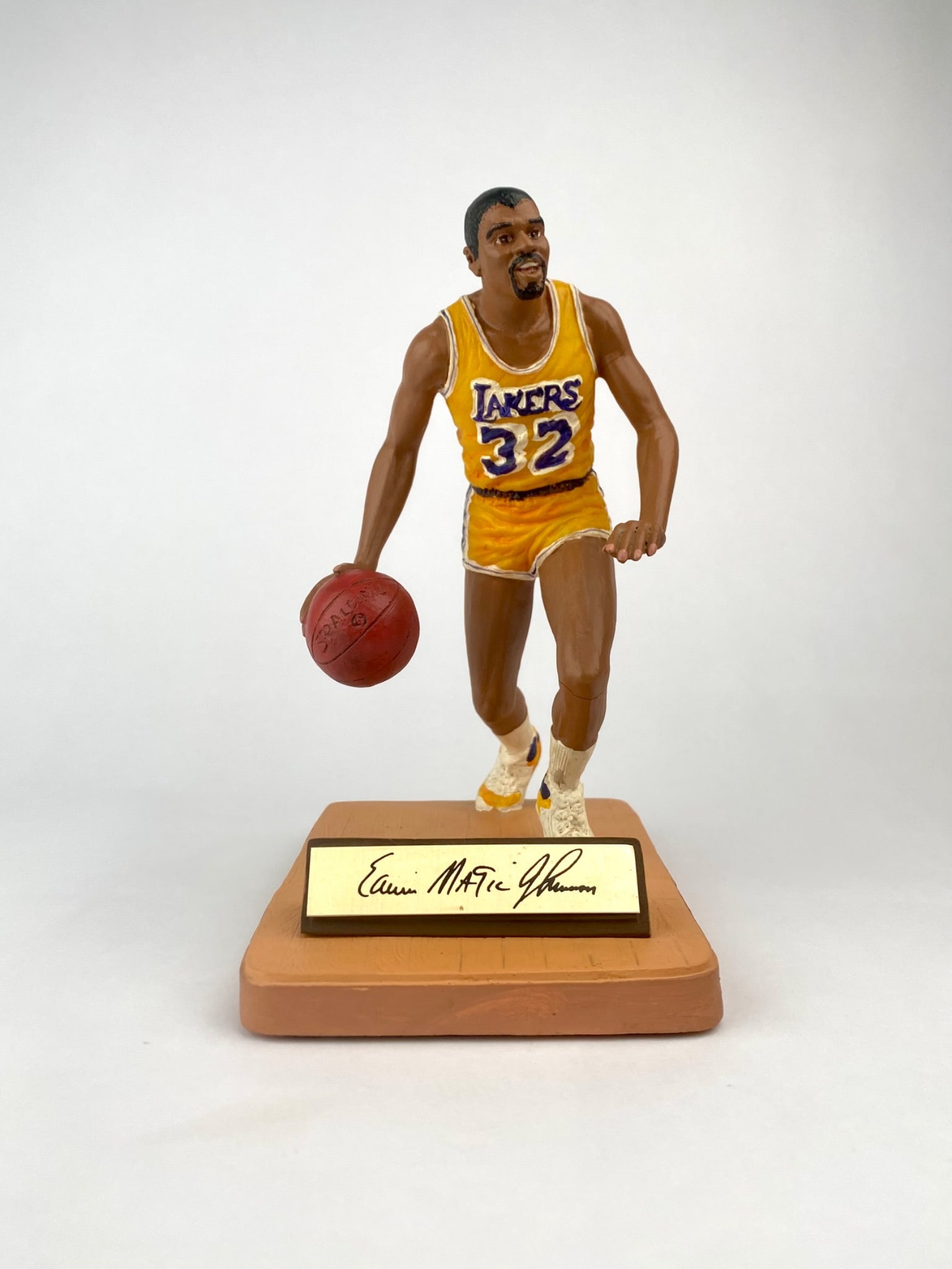 1988 Gartlan Magic Johnson “Magic in Motion?? Limited Edition Figurine: Limited edition Magic Johnson figurine from Gartlan USA’s “Gold Rim Series,” titled “Magic in Motion.” The painted figurine depicts Johnson in his classic Lakers #32 uniform, mid-dri