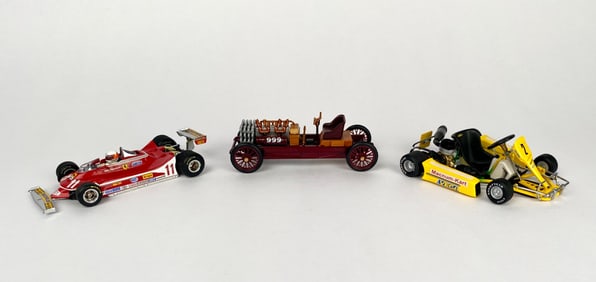 Three Die-Cast Vehicles Featuring Ferrari, Ford, and Go-Kart Models