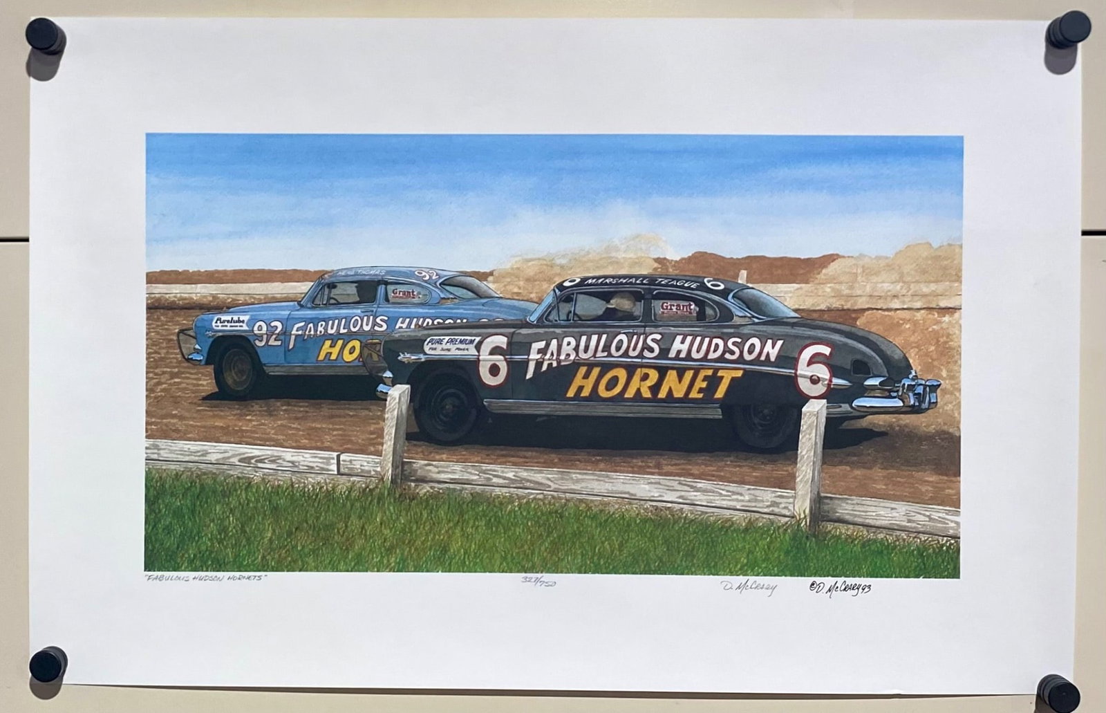 Limited Edition ‘Fabulous Hudson Hornets’ Racing Print by D. McCrary: Limited edition print titled ‘Fabulous Hudson Hornets,’ by artist D. McCrary, numbered 327/750. Signed and dated by the artist as ‘D. McCrary 93.’ Features two Hudson Hornet race cars in a det