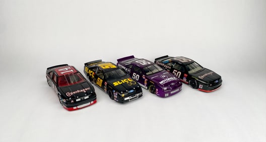Four NASCAR Diecast Model Cars with Sponsor Graphics