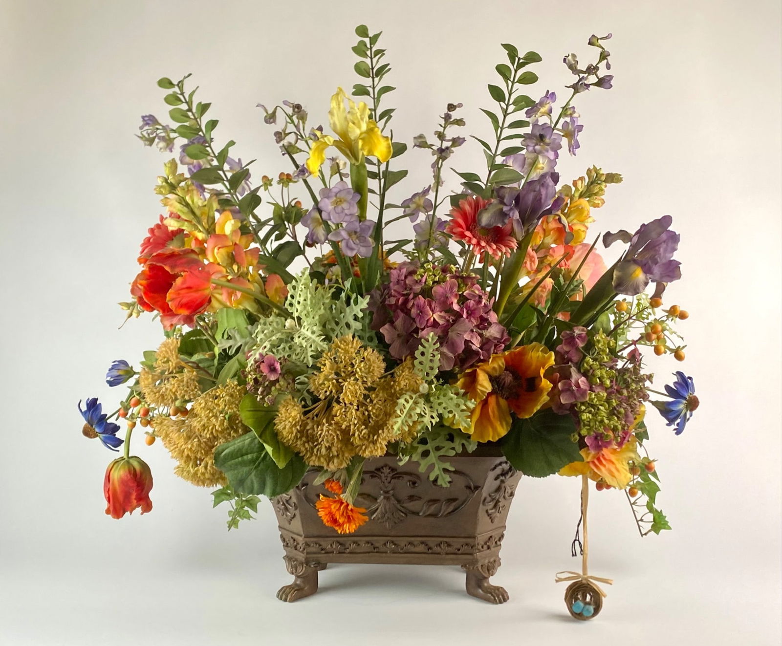 NDI Faux Floral Arrangement in Ornate Footed Planter with Bird Nest Accent (1 of 12)