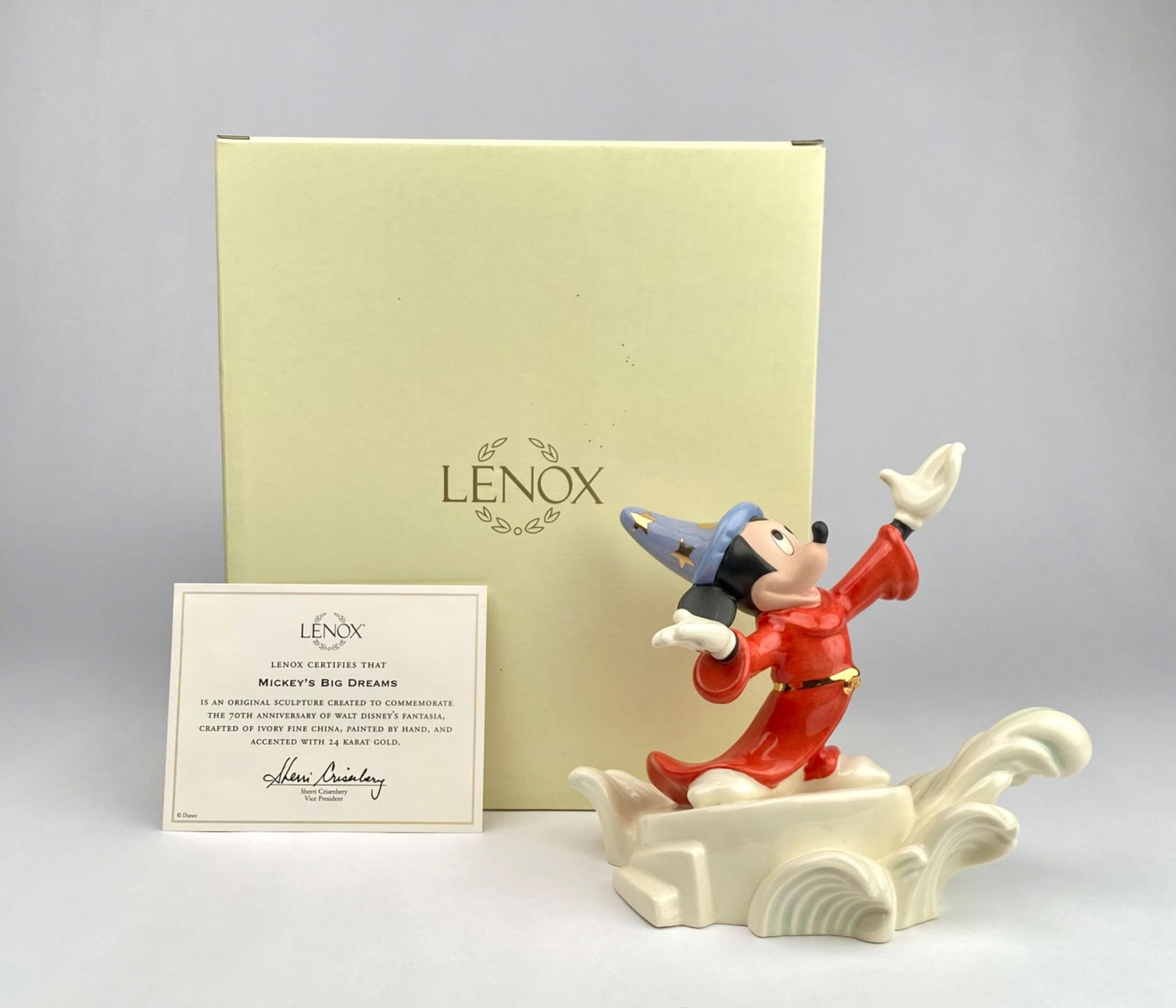 Lenox Disney ‘Mickey’s Big Dreams’ 70th Anniversary Figurine: Lenox Disney Showcase Collection sculpture titled “Mickey’s Big Dreams,” commemorating the 70th Anniversary of Walt Disney’s Fantasia. Crafted of ivory fine china, hand-painted, and accent