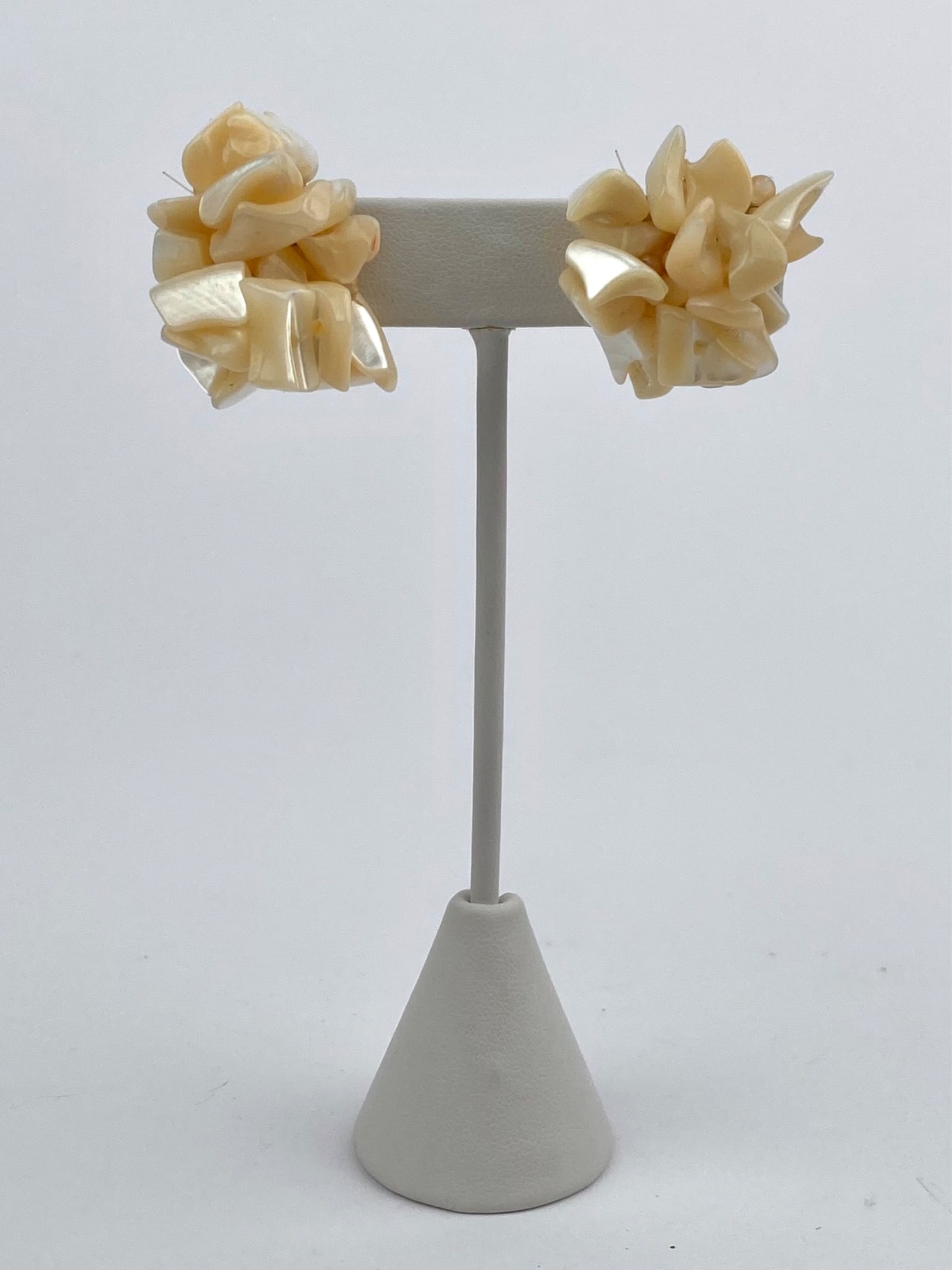 Vintage Faux Mother-of-Pearl Cluster Screw Back Earrings: Pair of vintage screw-back earrings featuring cream and pearlescent faux mother-of-pearl pieces arranged in a clustered form with silver tone hardware. Light surface wear is present consistent with ag