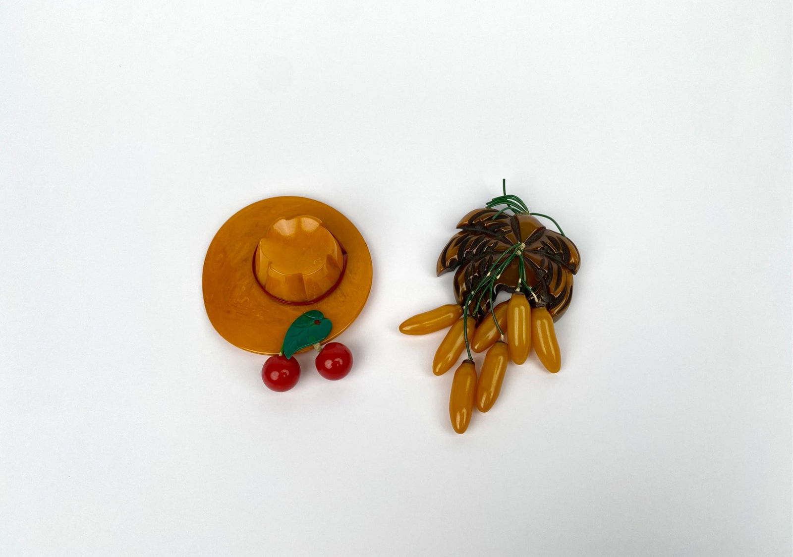 Pair of Bakelite Brooches Featuring Hat with Cherries & Fruit Cluster (1 of 9)