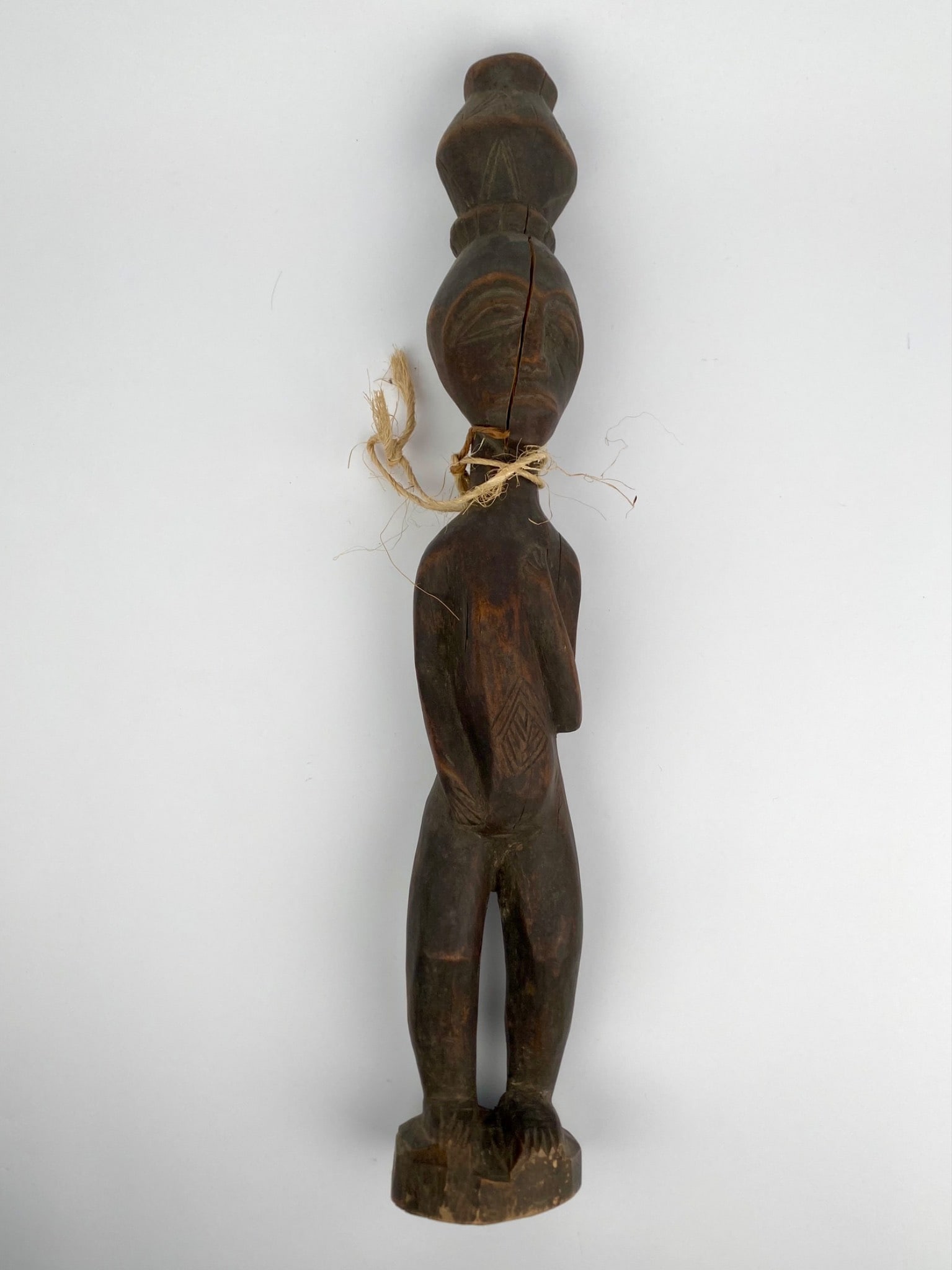 West African Carved Wooden Figure with Geometric Torso Motif (1 of 11)
