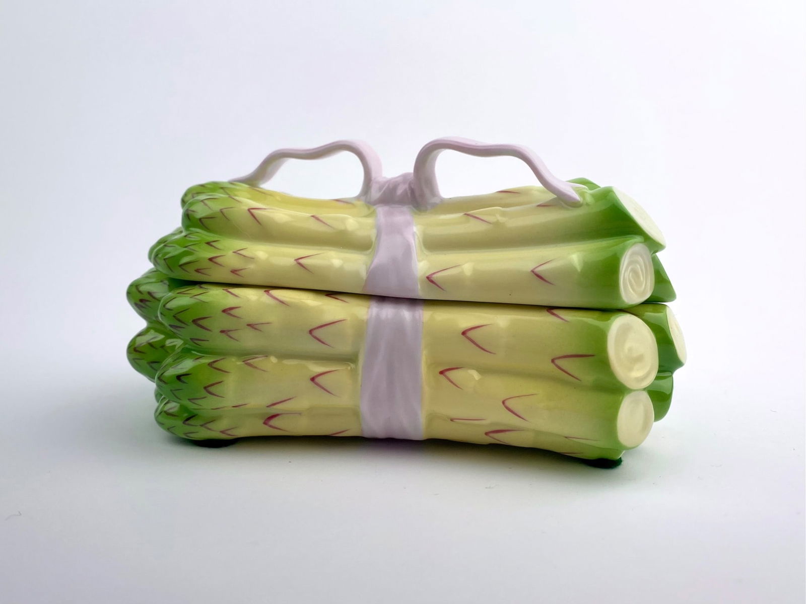 Herend Hungary Hand?Painted Asparagus Buddle Covered Porcelain Box: Hand-painted porcelain covered box by Herend, Hungary, modeled in the form of a tied bundle of asparagus. The underside of the lid bears the blue Herend Hungary Hand painted mark along with the patter