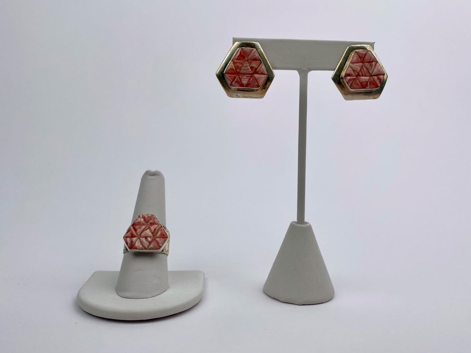 Sterling Silver Carved Coral Ring and Earring Set: Matching ring and stud earring set featuring hexagonal carved coral panels with geometric starburst-style detailing, mounted in sterling silver settings. The ring is marked “DK CHINA .925,” an