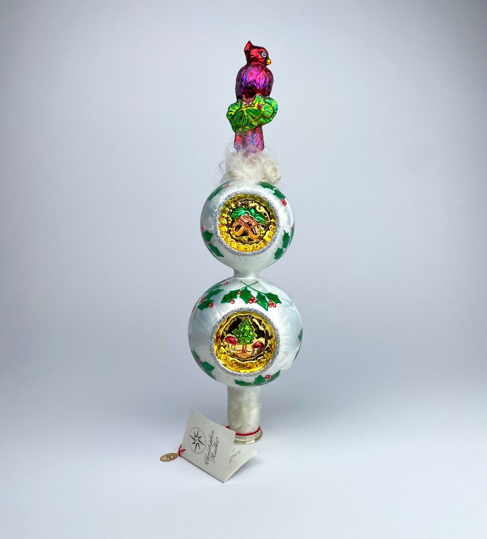 Christopher Radko ‘Cardinal Rules’ Finial Christmas Tree Topper Ornament: Christopher Radko ‘Cardinal Rules’ Finial Ornament featuring a hand-painted cardinal atop two stacked, white reflective orbs adorned with holly leaves and berries. Each orb contains delicately det