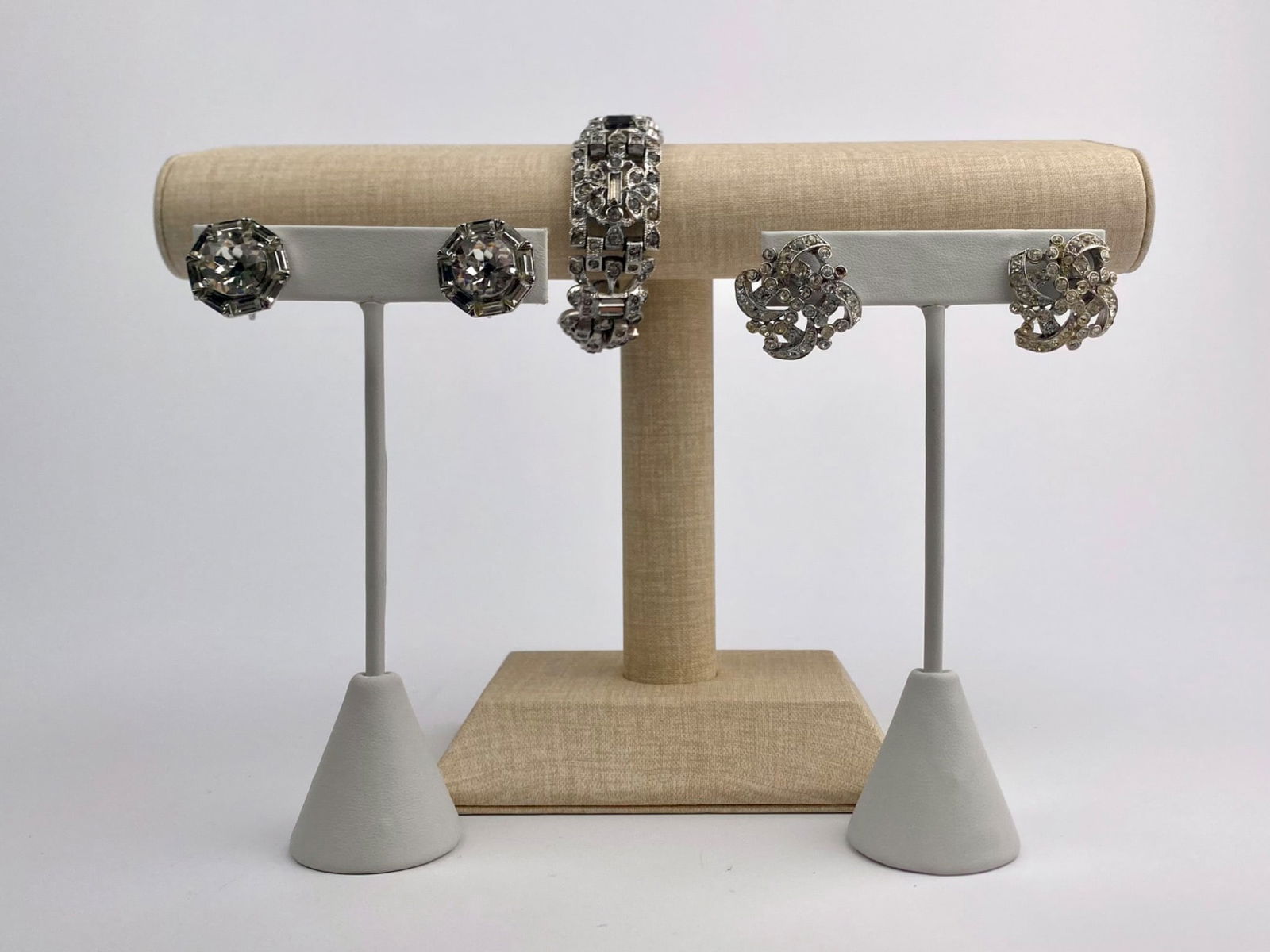 Vintage Rhinestone Bracelet with ORA and Kramer NY Earrings Set: Vintage costume jewelry group includes one silver-tone rhinestone bracelet and two pairs of coordinating rhinestone earrings. The bracelet features articulated geometric links set with clear rhineston