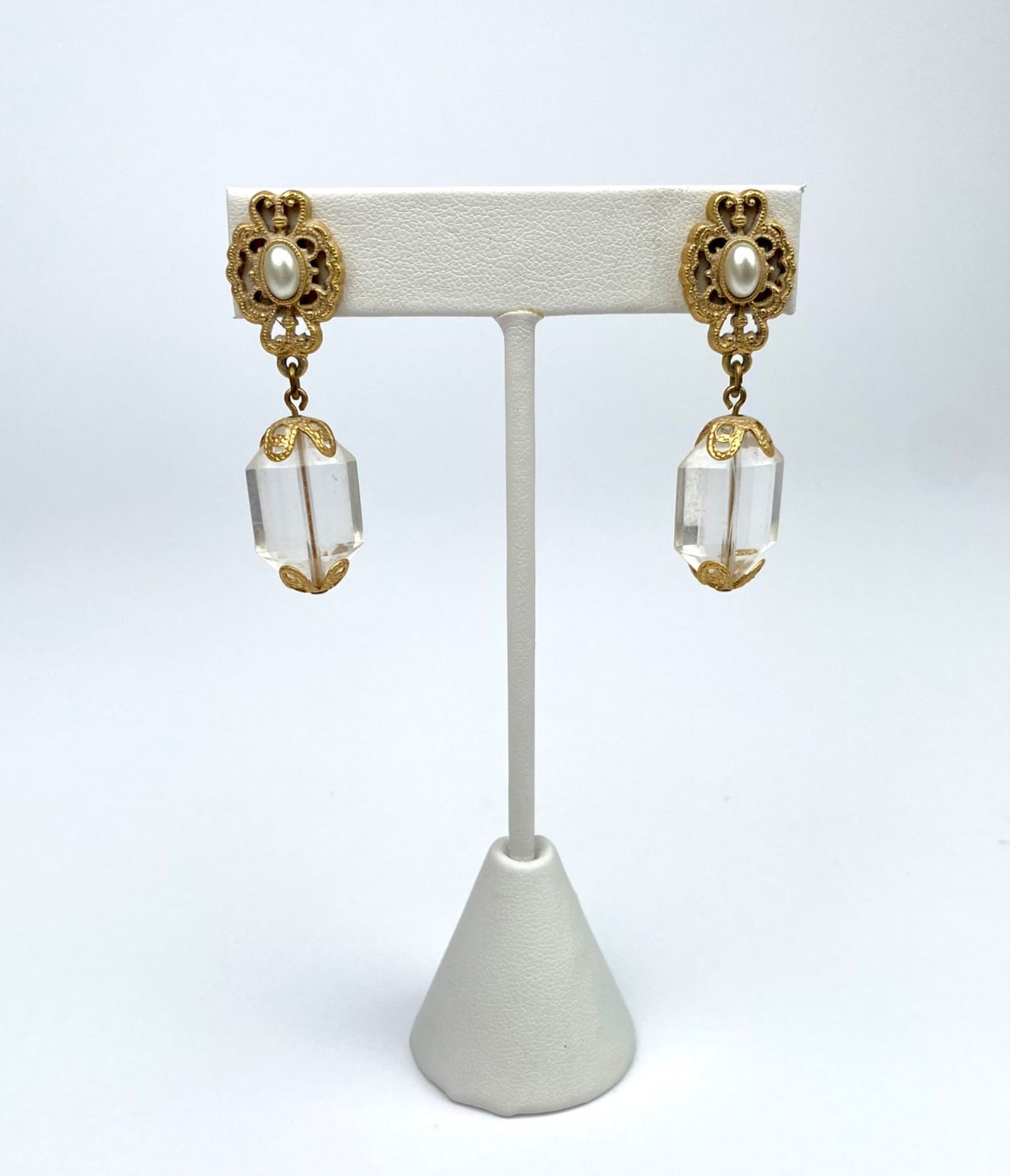 Vintage Gold-Tone Drop Earrings with Crystal Accents: Gold-tone drop earrings featuring ornate filigree settings with faux pearl accents at the top and clear faceted crystal dangles. | Please see photos for additional details. | Dimensions of One Earring
