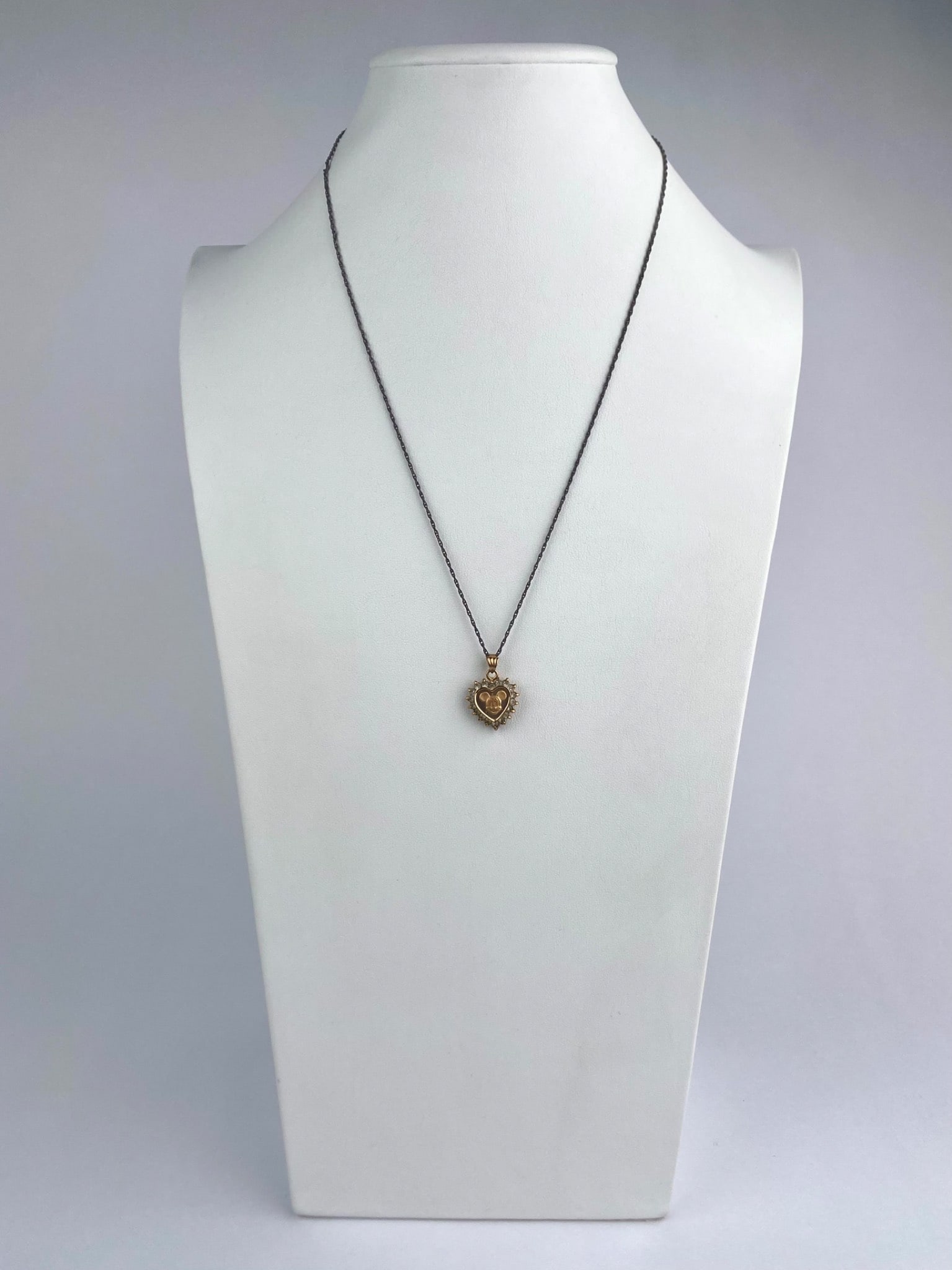 Disney Mickey Mouse Heart Pendant Necklace: Disney Mickey Mouse heart pendant necklace featuring a gold-tone heart-shaped pendant with a raised Mickey Mouse head at center, surrounded by a halo of rhinestones. The pendant is suspended from a da