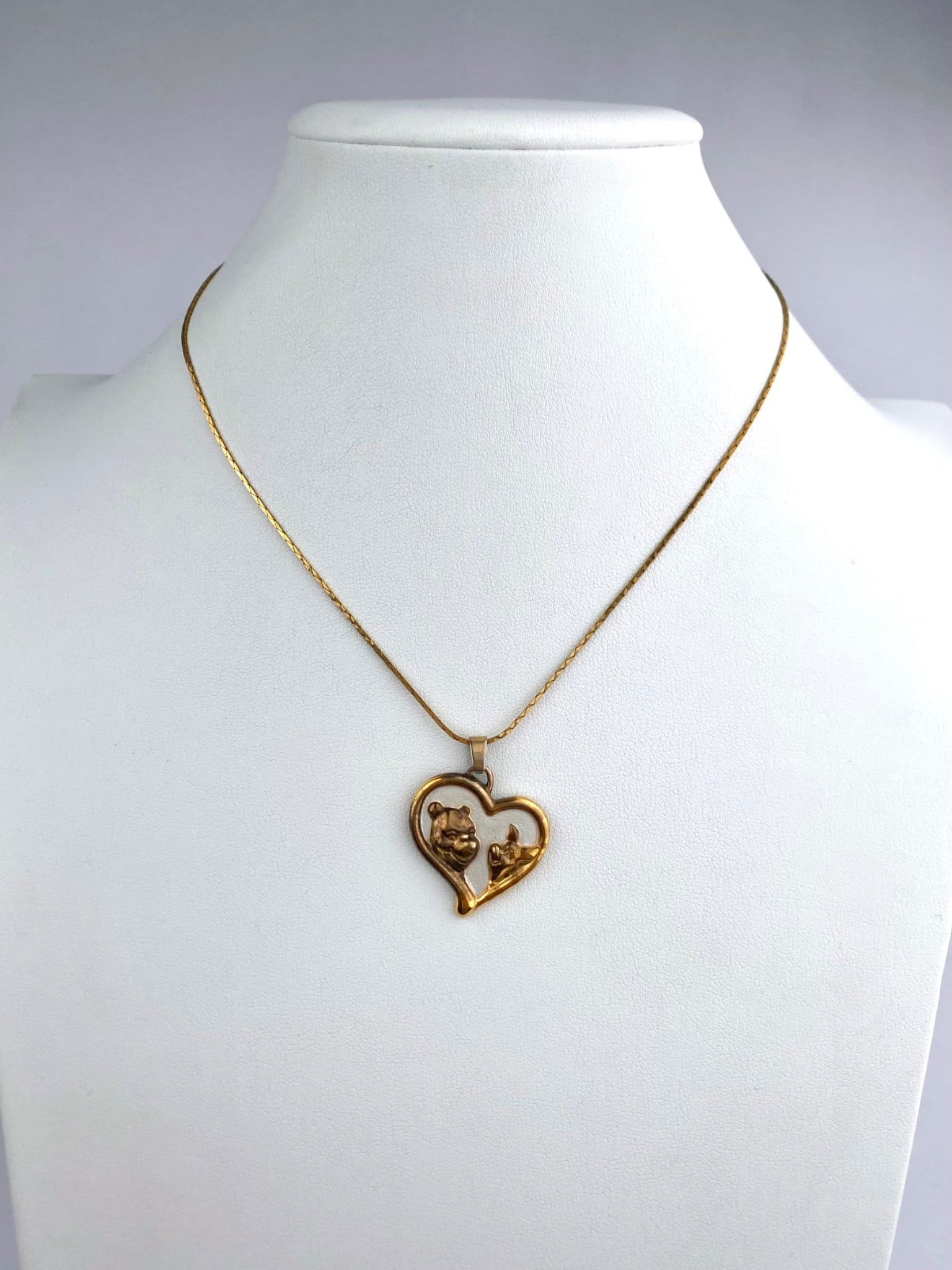 Lenox sterling silver Disney necklace featuring an open-heart pendant with raised figural depictions: Lenox sterling silver Disney necklace featuring an open-heart pendant with raised figural depictions of Winnie the Pooh and Piglet facing each other. The reverse is engraved with "Start each day with