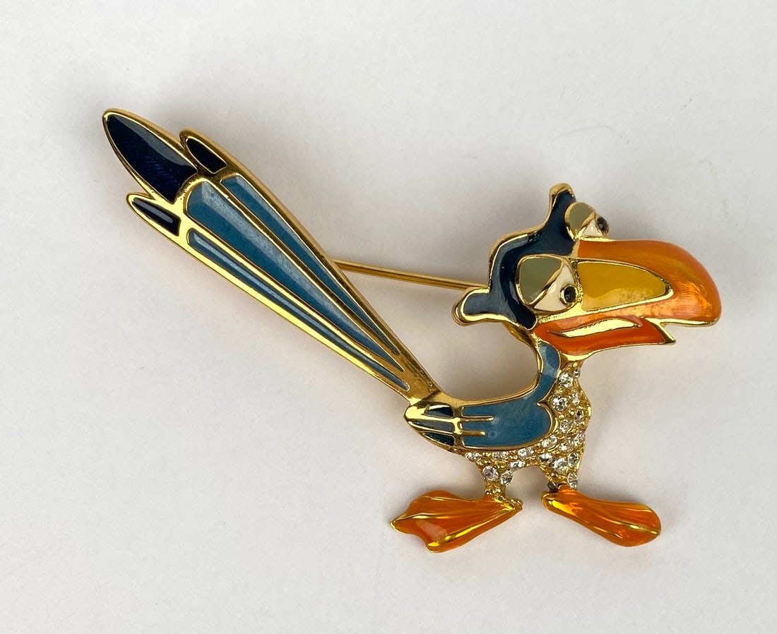 Disney Gold-Tone & Enamel ‘The Lion King’ Zazu Brooch: Disney gold-tone brooch featuring Zazu from 'The Lion King' with vibrant blue and orange enamel detailing and crystal accents. Marked “Disney” on the reverse. Pin closure is in working conditi